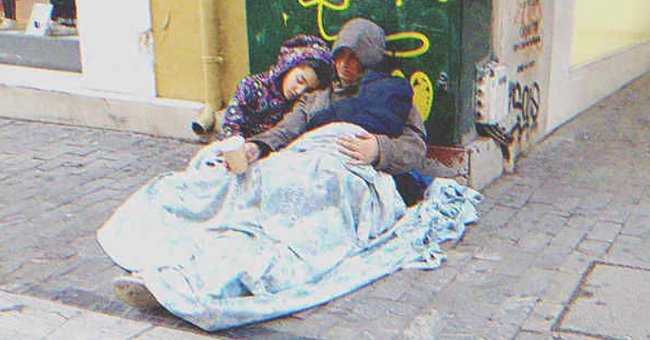 A homeless mother and her childs sleeping on the street | Source: Shutterstock