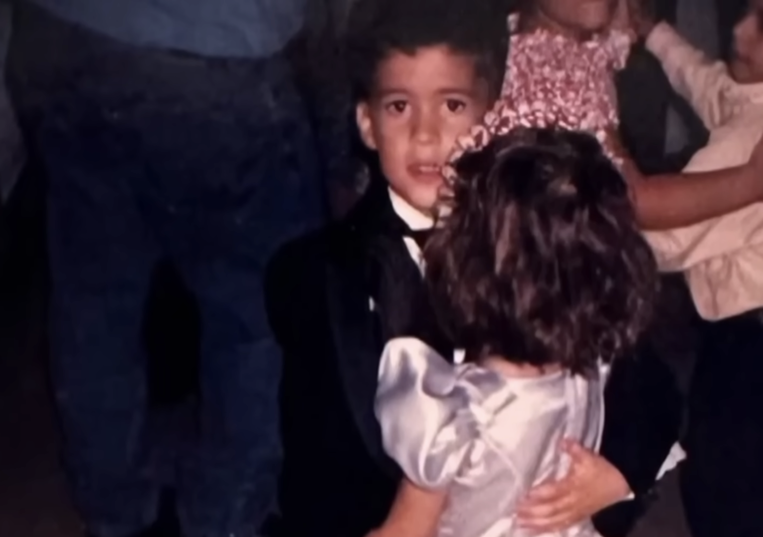 Bad Bunny in a suit dances with a girl, from a post dated August 31, 2025. | Source: YouTube/TODAY
