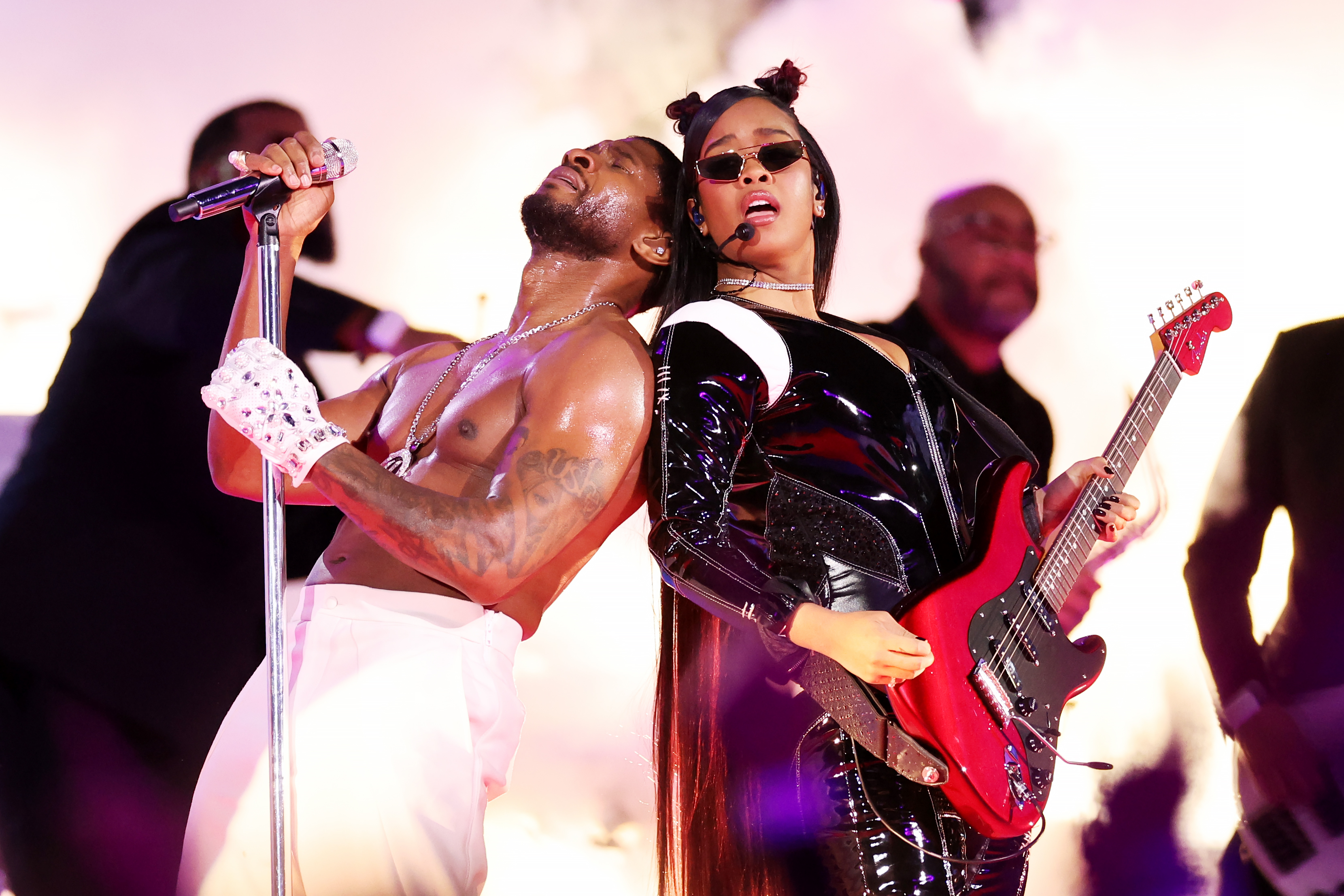 Usher and H.E.R. perform during the Apple Music Super Bowl LVIII Halftime Show on February 11, 2024 in Las Vegas, Nevada | Source: Getty Images