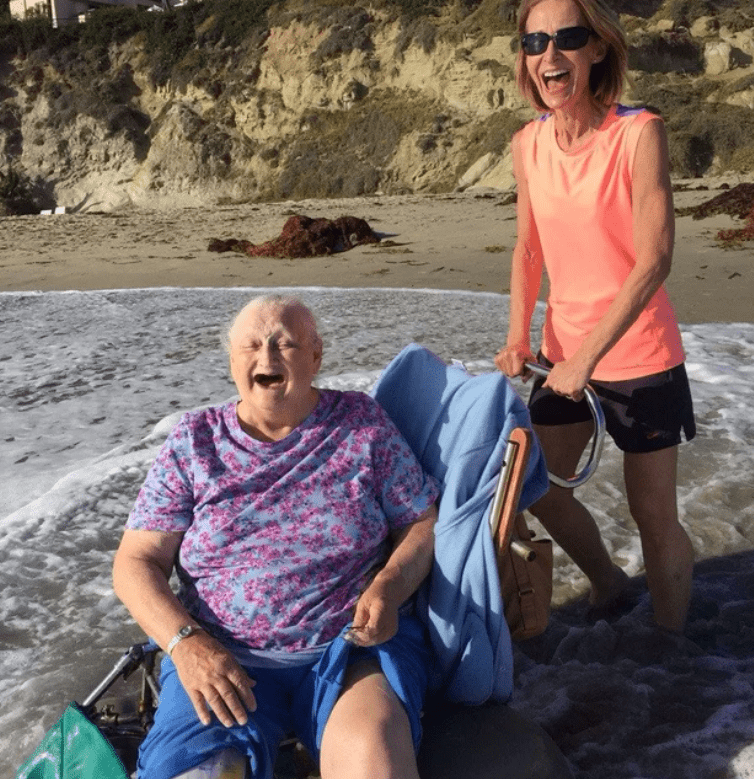 A woman laughing in the ocean with her grandmother. │Source: reddit.com/u/ecost