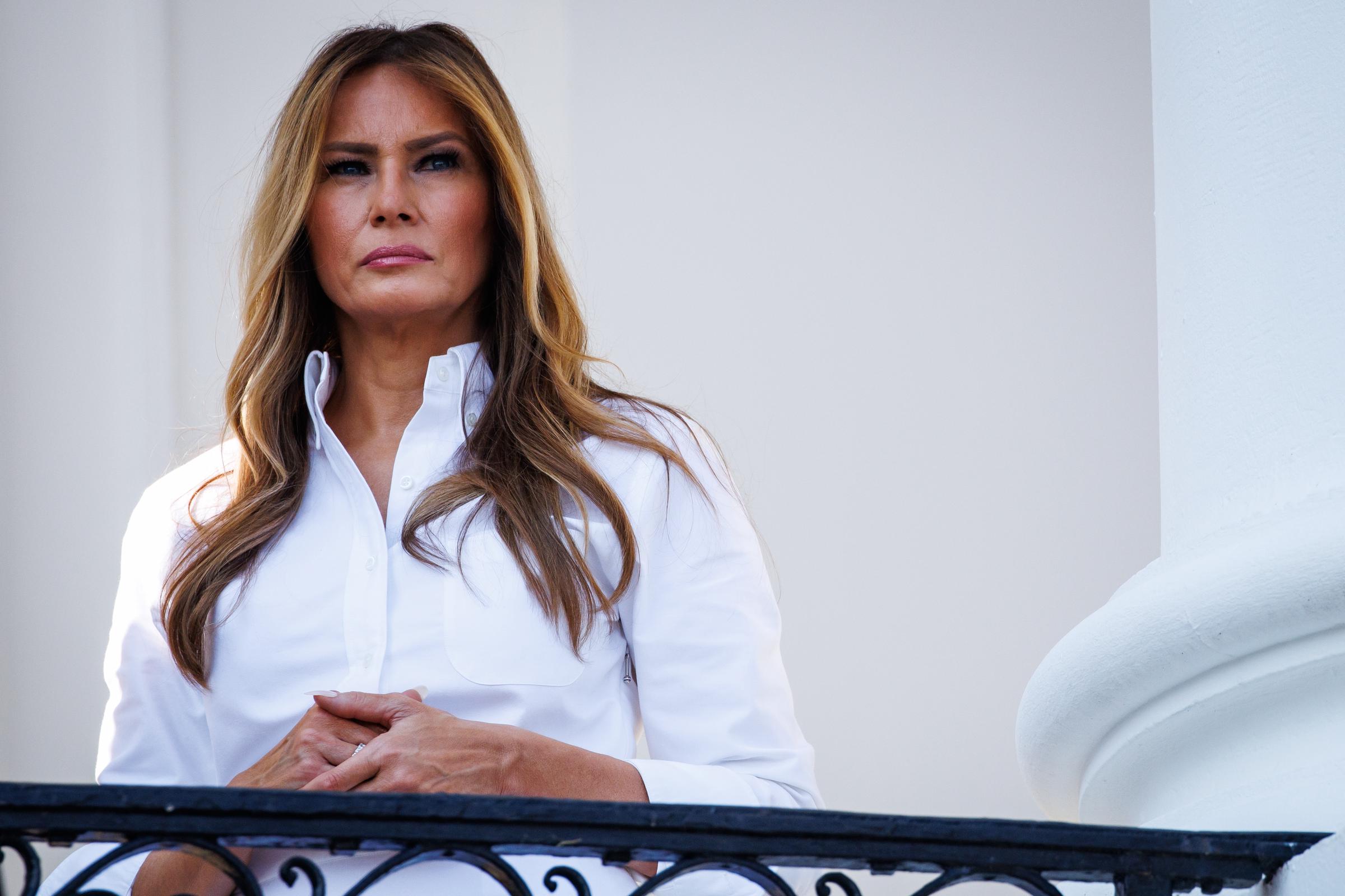 Melania Trump listens as Donald Trump speaks at a military family picnic on the White House South Lawn on July 4, 2025 | Source: Getty Images