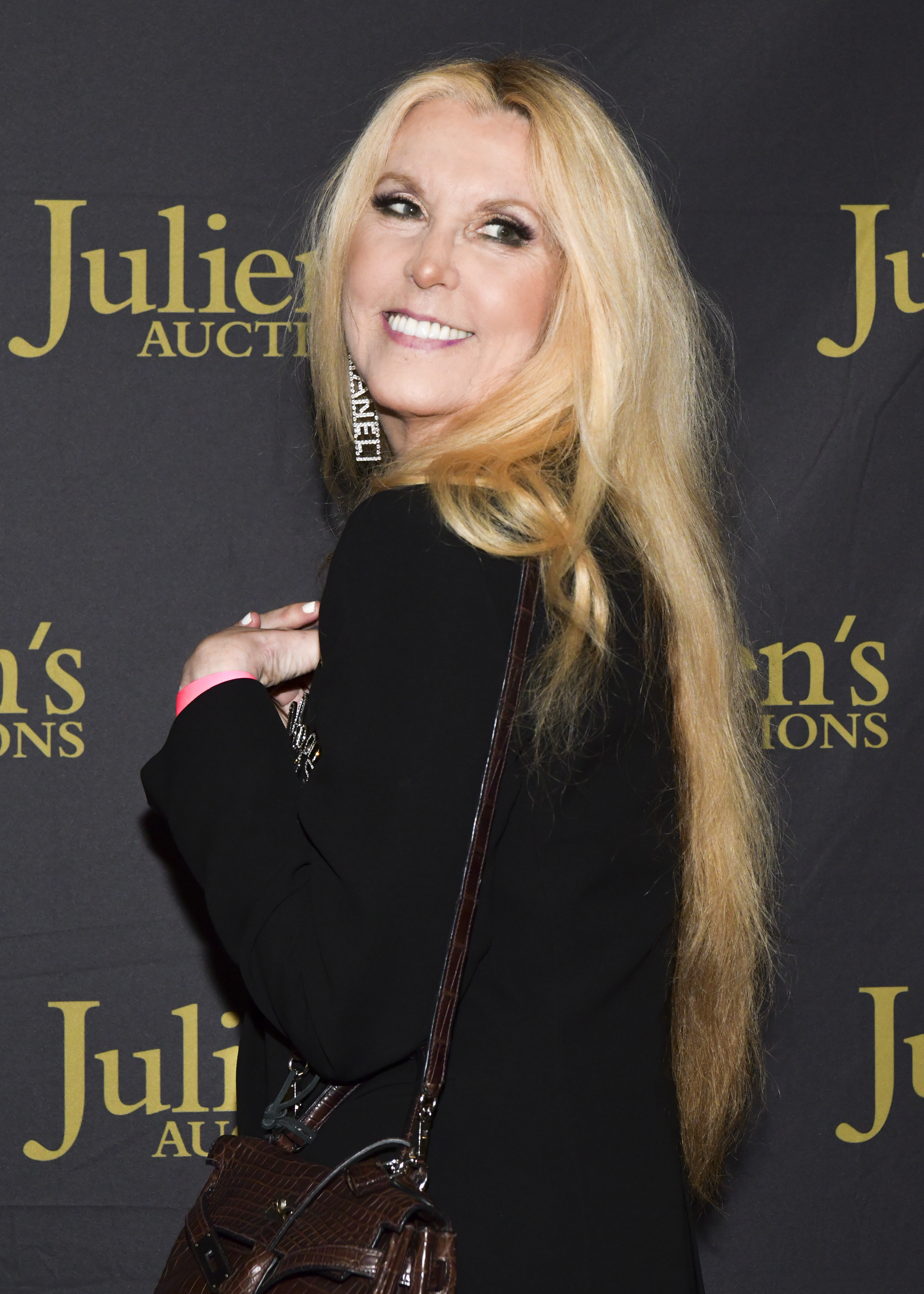 Joan Celia Lee during the VIP reception for "Property of Olivia Newton-John Auction Event" at Julien’s Auctions on October 29, 2019, in Beverly Hills, California. | Source: Getty Images