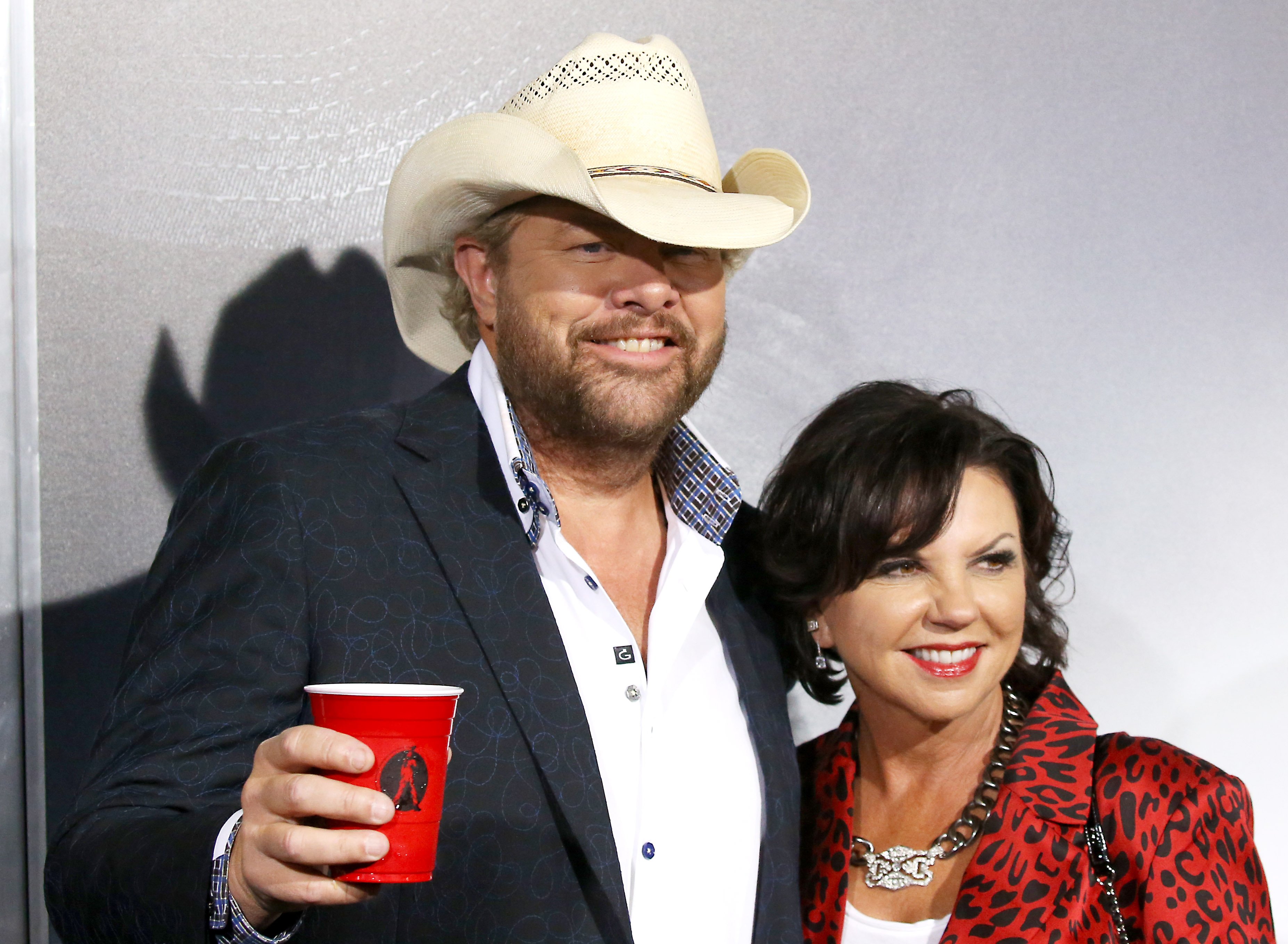 Toby Keith and Tricia Lucus attend the Warner Bros. Pictures world premiere of 