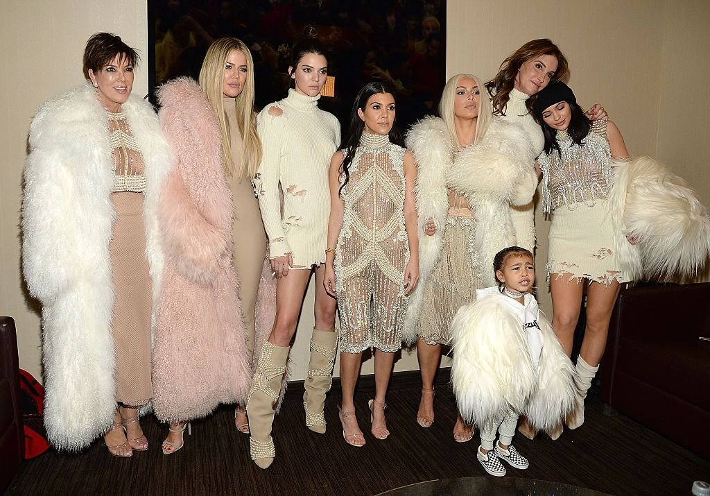 Khloe Kardashian, Kris Jenner, Kendall Jenner, Kourtney Kardashian, Kim Kardashian West, North West, Caitlyn Jenner and Kylie Jenner at Kanye West Yeezy Season 3 in 2016 in New York | Source: Getty Images 
