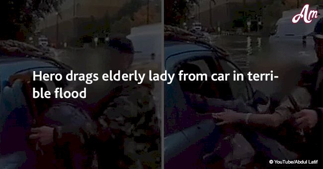 Hero drags elderly lady from car in terrible flood