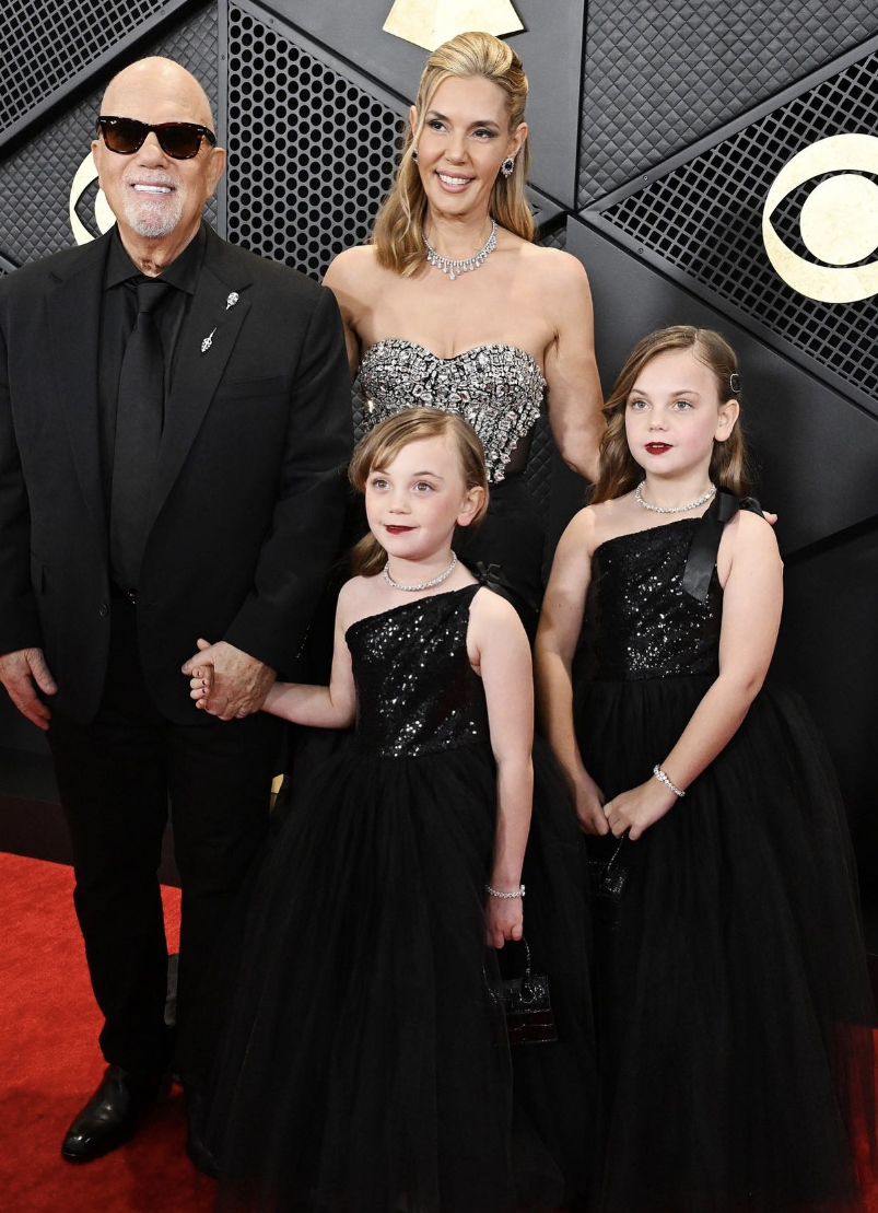 Billy and Alexis Joel with their daughters, Della Rose and Remy Anne at the Grammy Awards as seen in an Instagram carousel dated February 4, 2024 | Source: Instagram.com/entertainmenttonight/