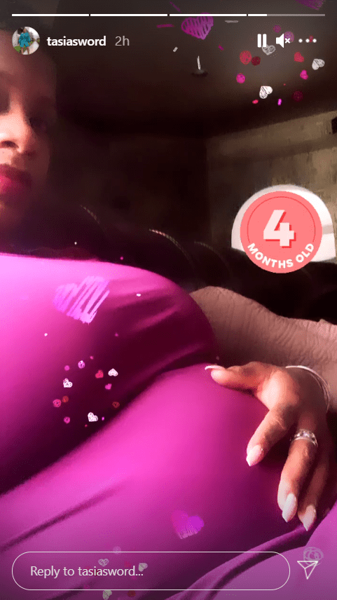 A picture of Fantasia Barrino flaunting her baby bump in a purple dress. | Photo: Instagram/tasiasword