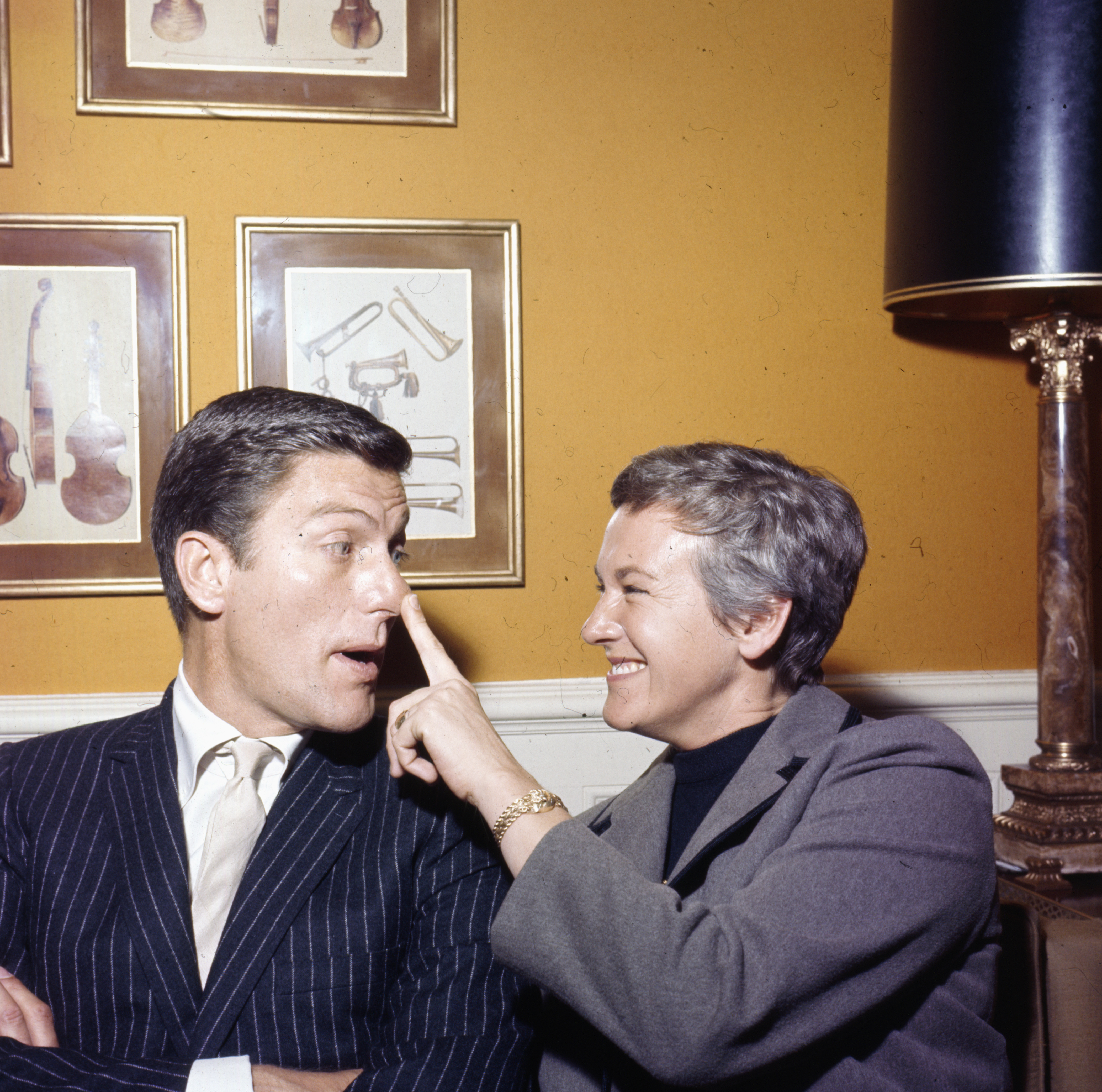 American actor Dick Van Dyke pictured with his wife Margie Willett in London in 1964. | Source: Getty Images