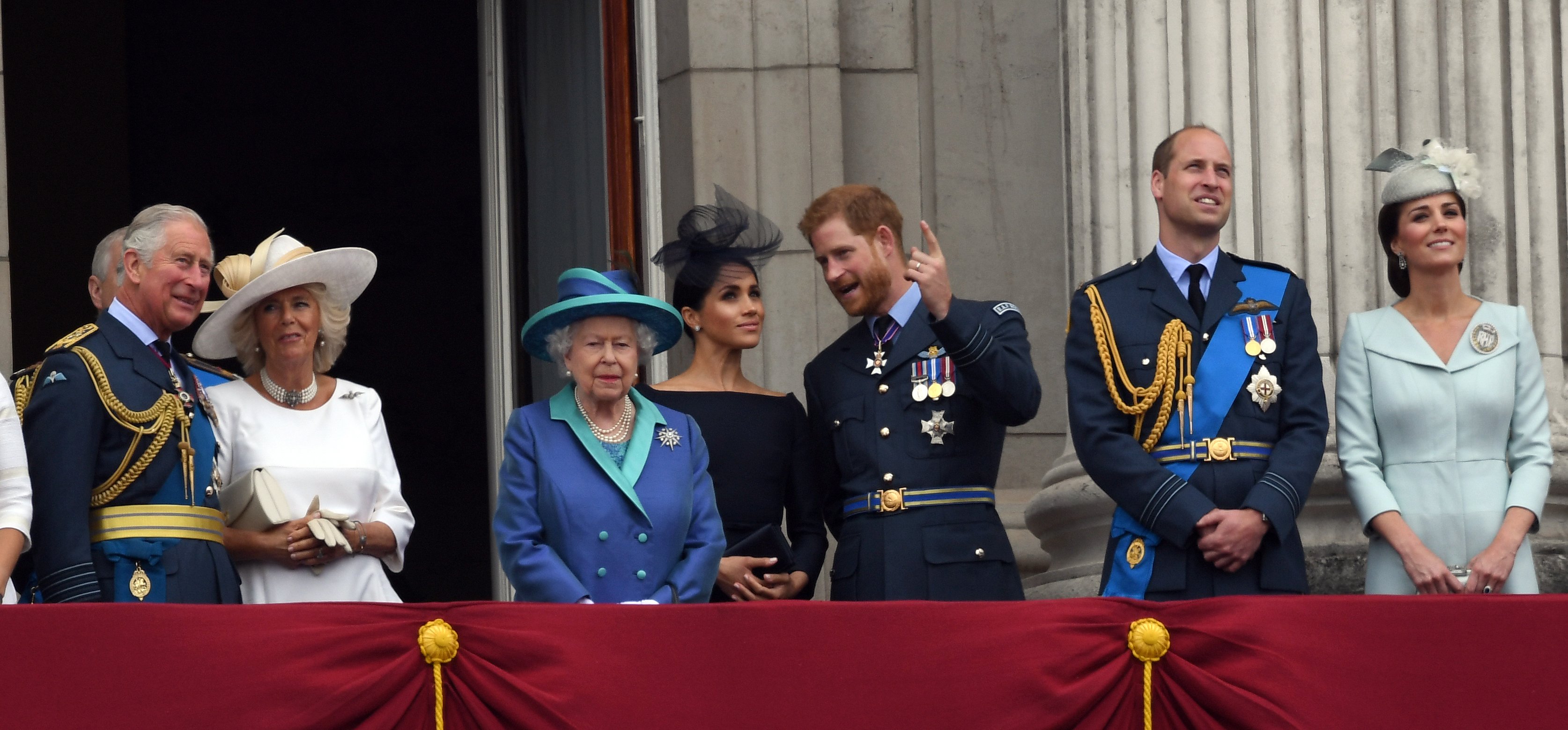 Prince Charles, Duchess Camilla, Queen Elizabeth ll, Duchess Meghan, Prince Harry, Prince William, and Duchess Kate on the balcony of Buckingham Palace to view a flypast to mark the centenary of the Royal Air Force (RAF) on July 10, 2018, in London, England | Source: Getty Images