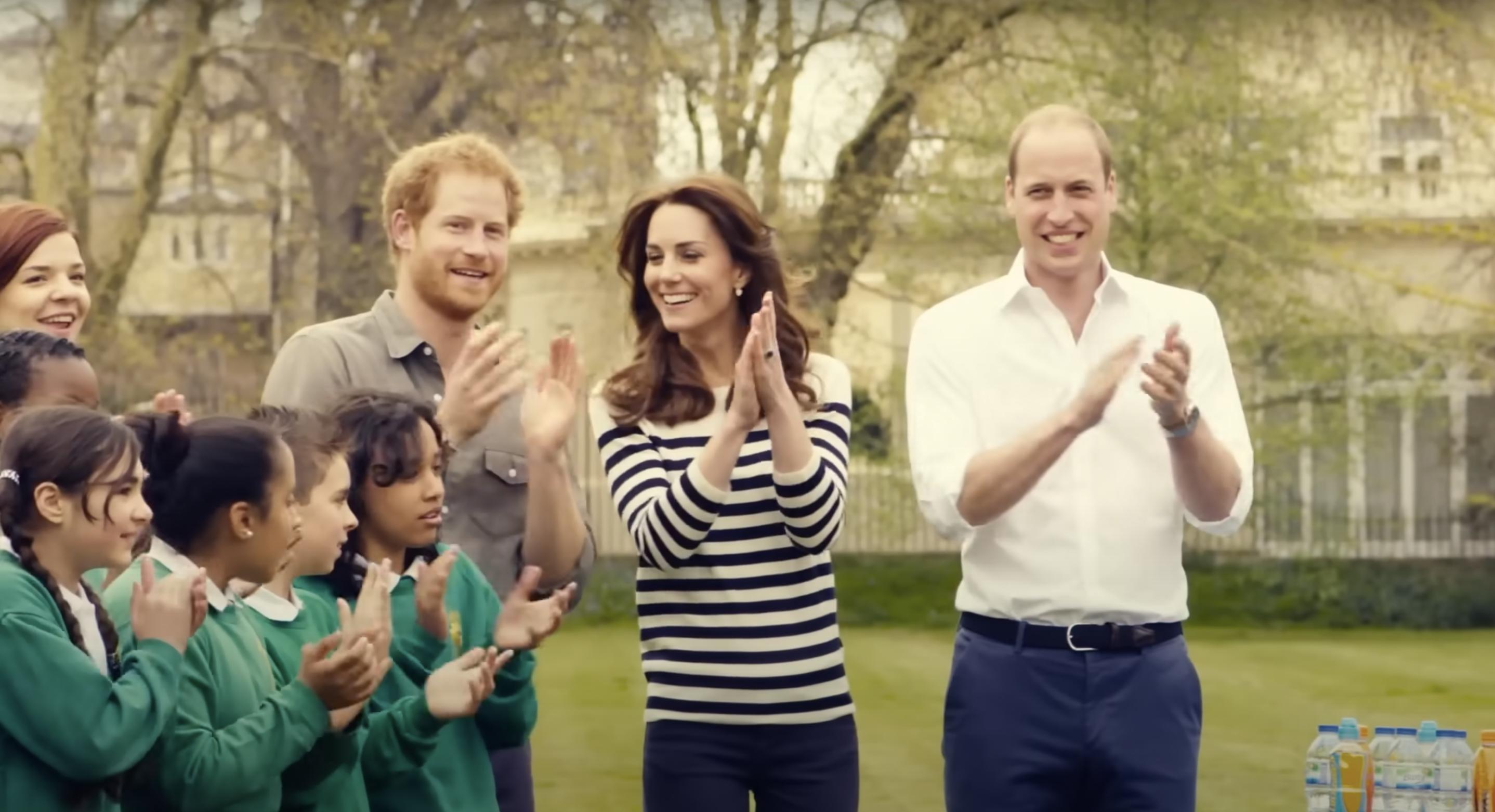 A sreenshot of Prince Harry, Catherine and Prince William taken from a video posted on April 24, 2016 | Source: YouTube/@_Place2Be