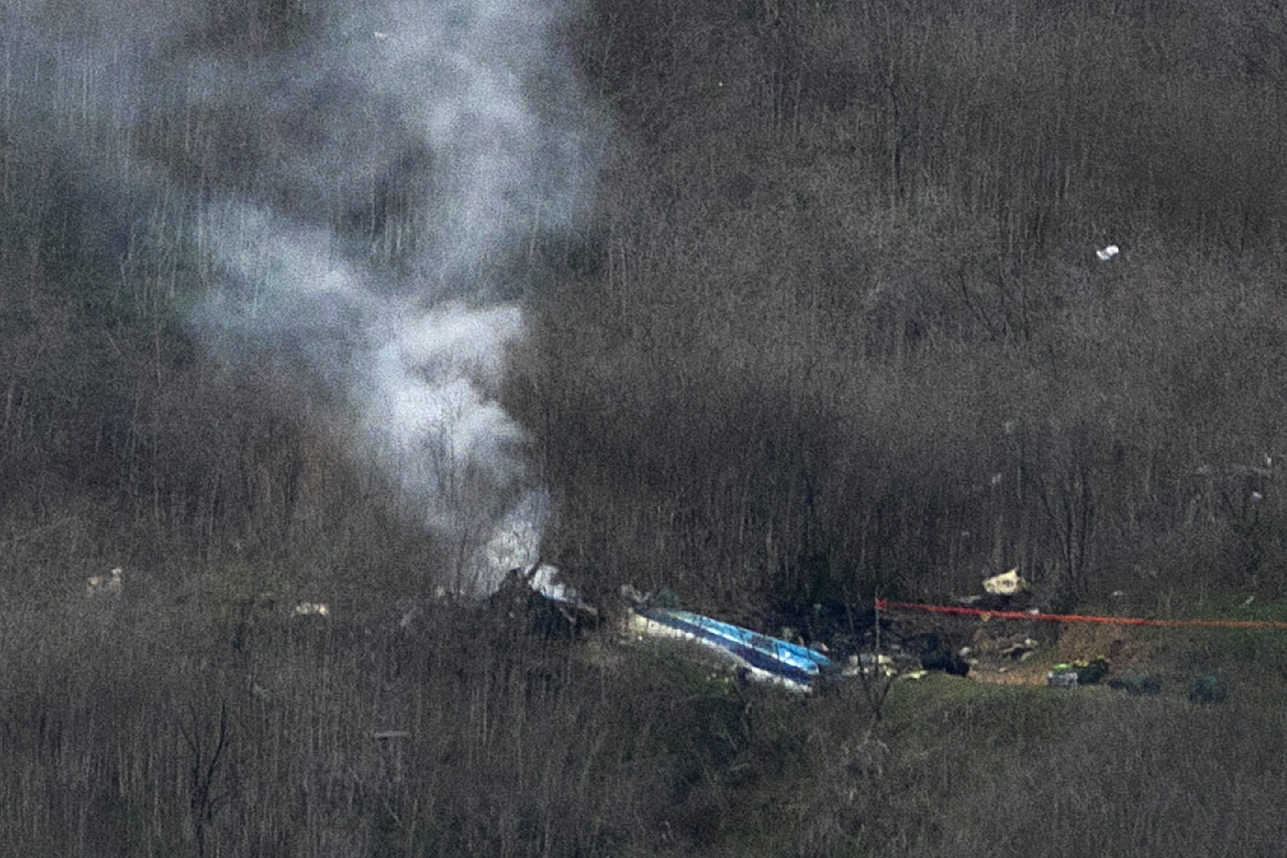 Wreckage of the crashed helicopter pictured on the ground on January 26, 2020, in Calabasas, California. | Source: Getty Images