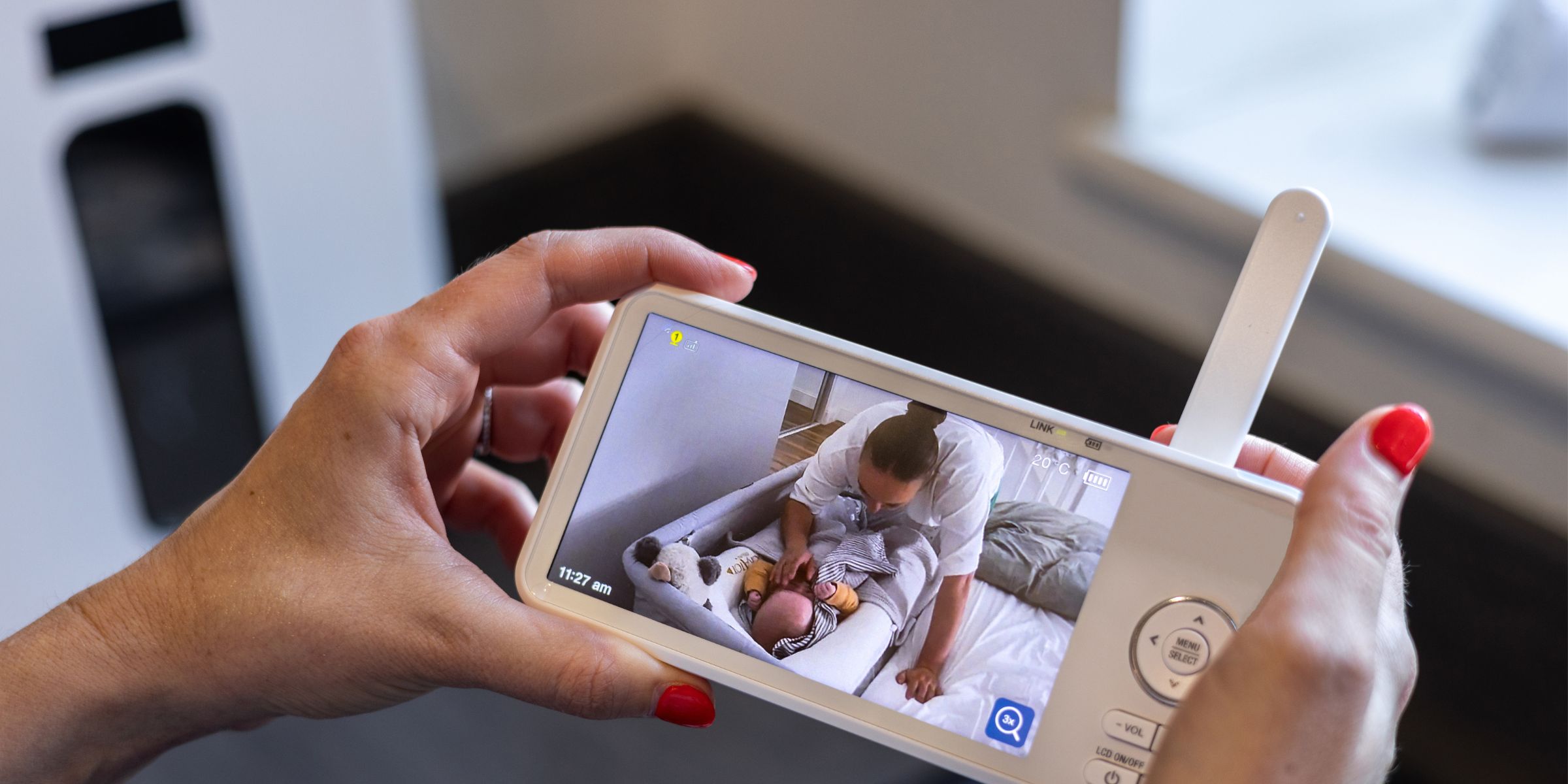 A person looking at a baby monitor | Source: Shutterstock