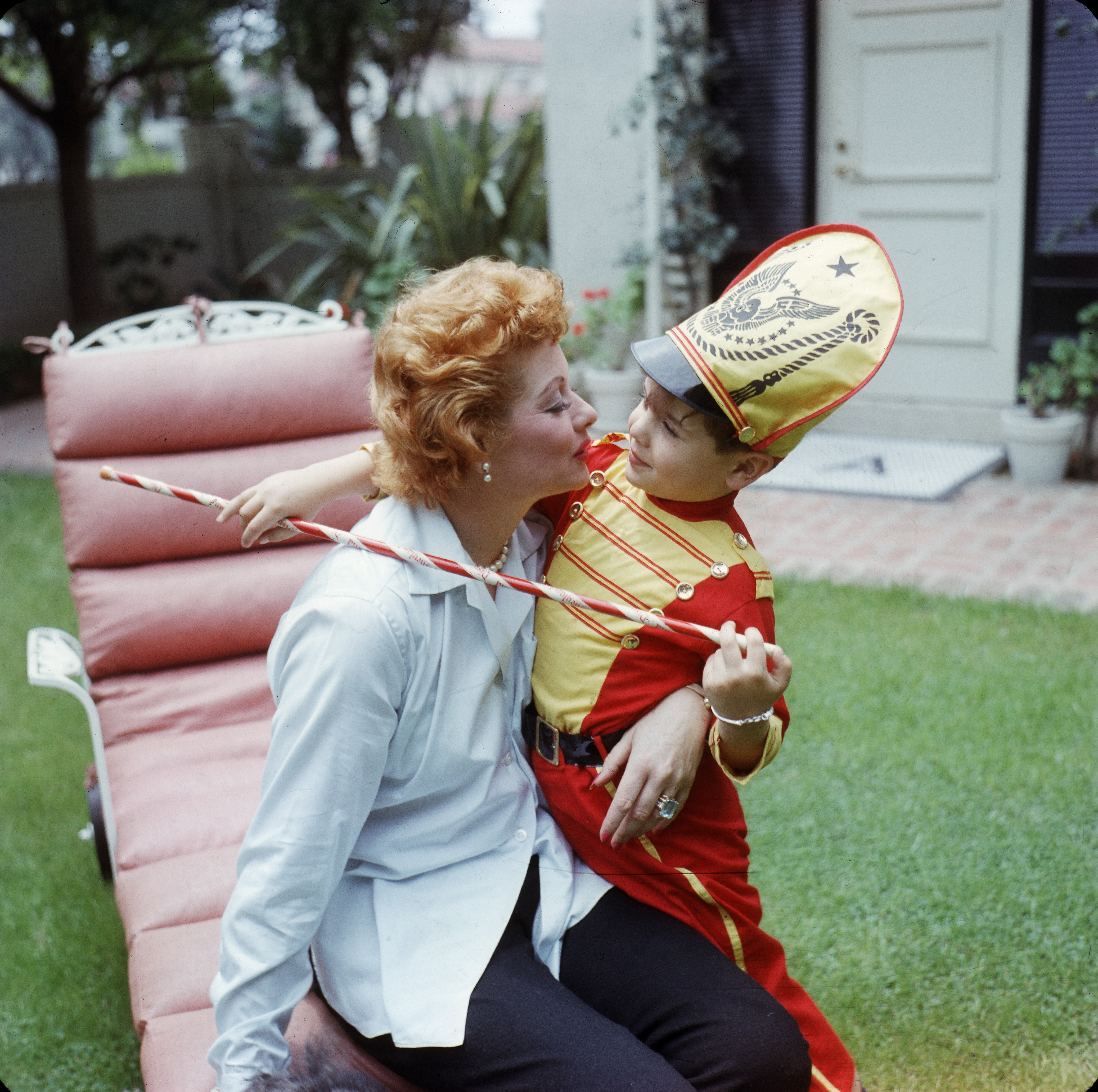 Lucille Ball and her son Desi Arnaz Jr. in the backyard of their Los Angeles, California home in the late 1950s | Source: Getty Images