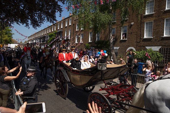 Duke and the Duchess of Sussex process through Windsor in the Ascot Landau carriage after getting married at St Georges Chapel on May 19, 2018, in Windsor, England. | Source: Getty Images.