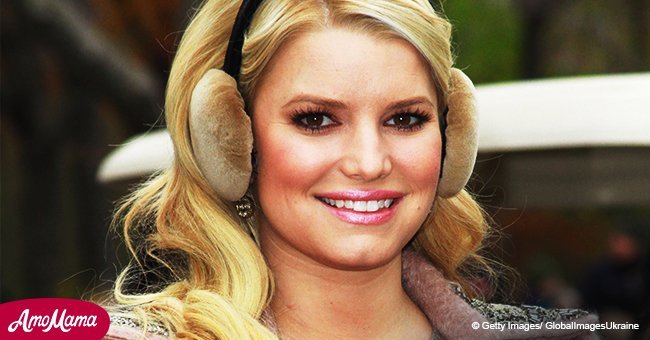 Jessica Simpson shares a playful snap with her hubby and two kids as she rocks a pink mini dress