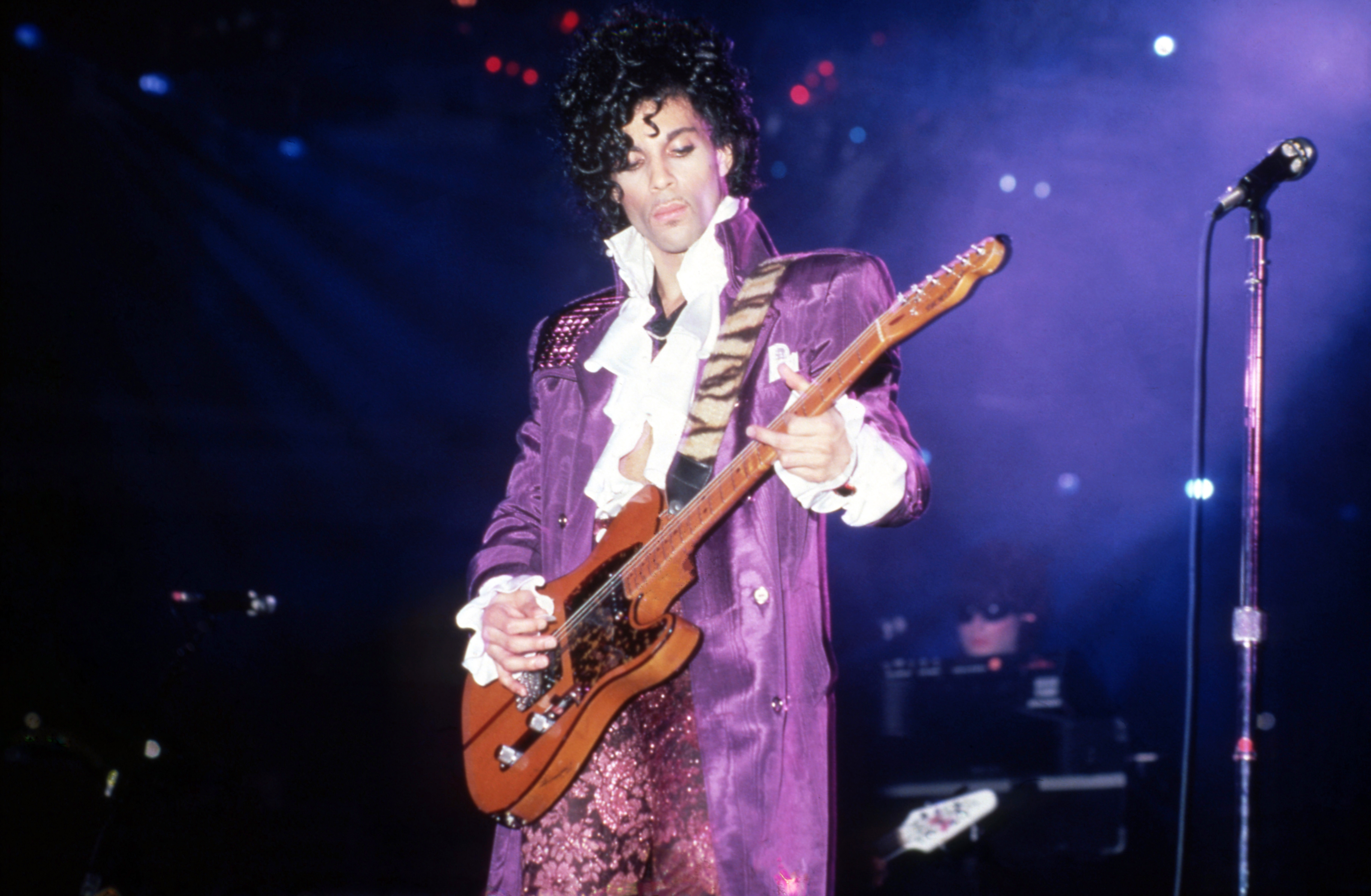 Prince performing during the "Purple Rain" tour in November 4,1984 in Detroit, Michigan | Source: Getty Images