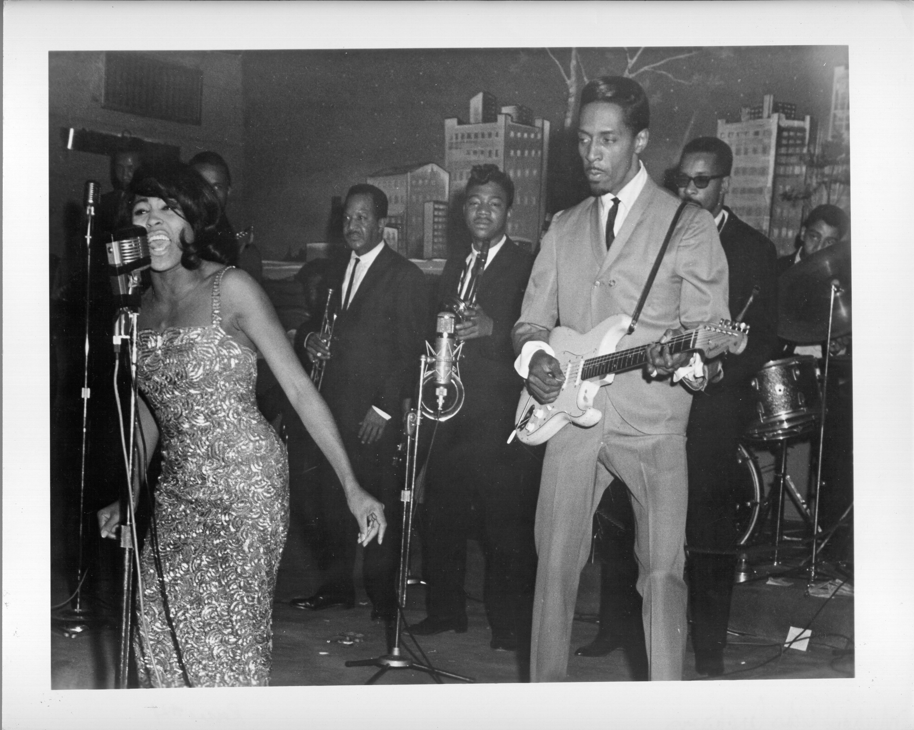 Husband-and-wife R&B duo Ike & Tina Turner perform onstage with a Fender Stratocaster electric guitar in 1964 in Dallas Fort Worth, Texas. | Source: Getty Images