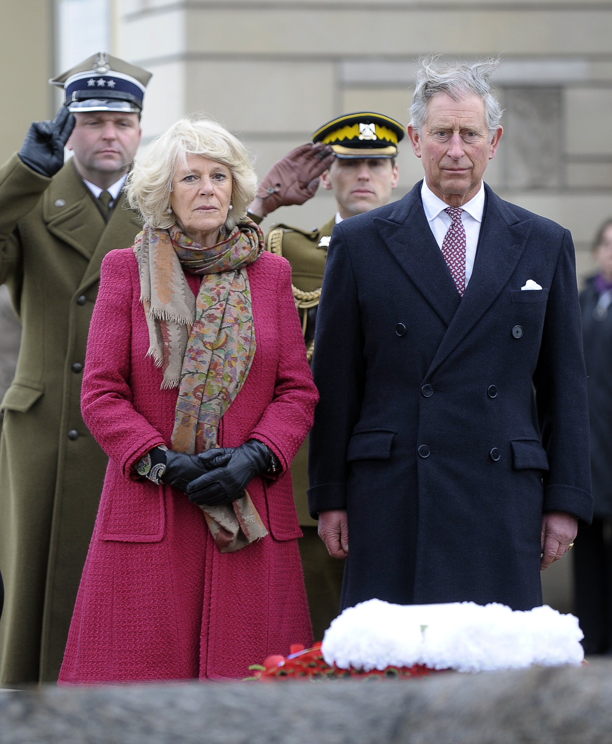 Duchess Camilla and Prince Charles at the grave of priest Jerzy Popieluszko on March 15, 2010, in Warsaw. | Source: Getty Images