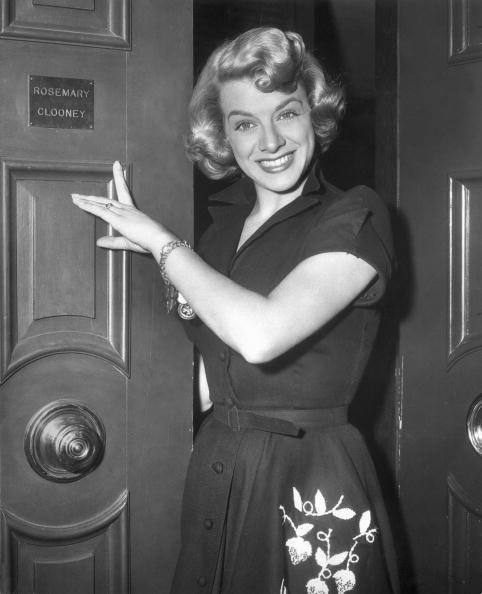 Rosemary Clooney points to her nameplate on the exterior of a door in this 1945 photograph. | Source: Getty Images.