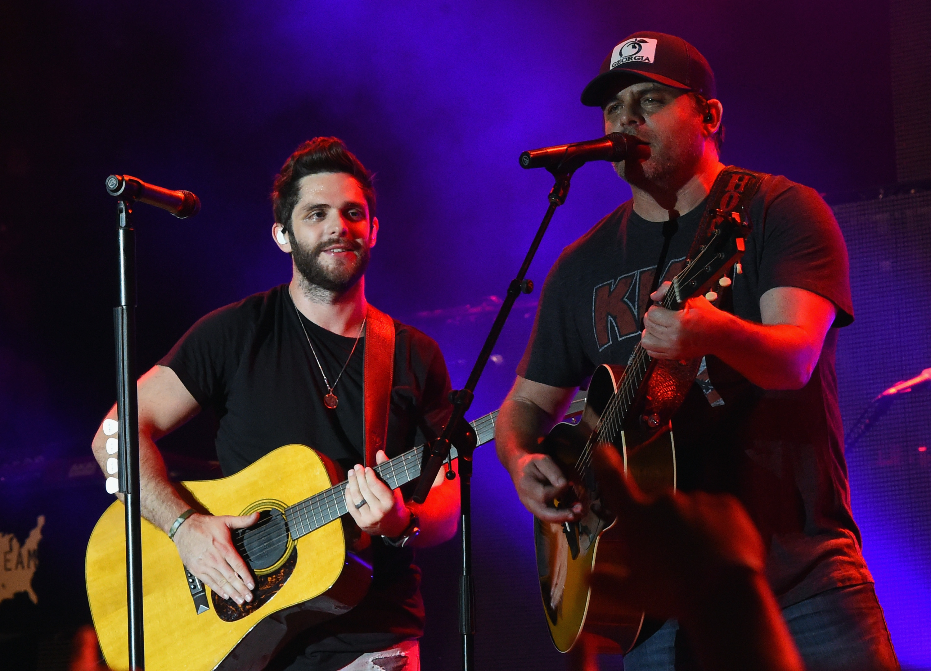 Thomas Rhett is joined on stage by his dad, Rhett Akins, during Pepsi's Rock The South Festival - Day 1 at Heritage Park on June 3, 2016, in Cullman, Alabama | Source: Getty Images