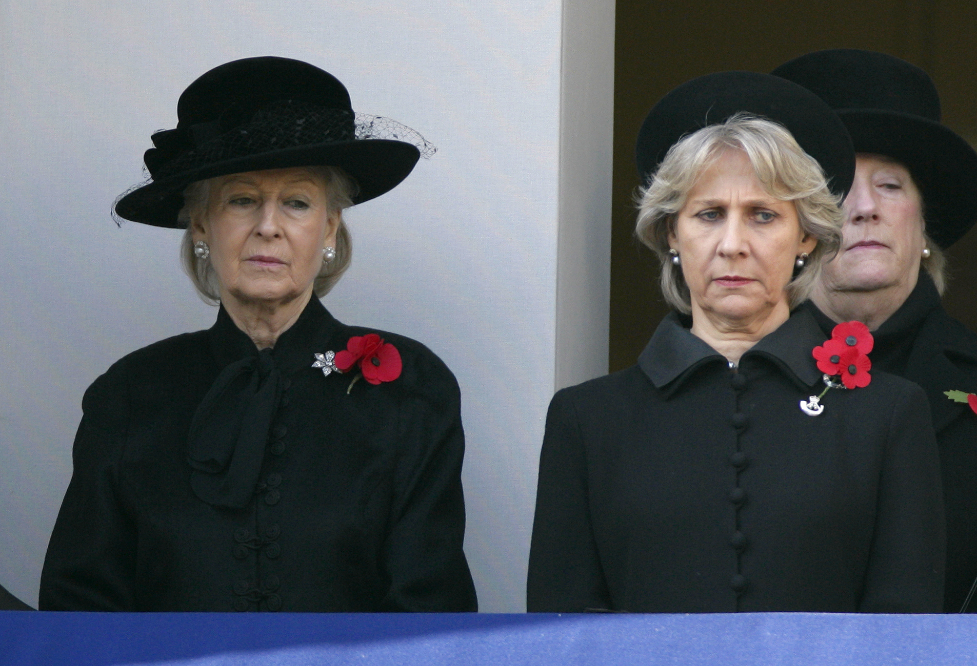Standing side by side with the Duchess of Gloucester, Princess Alexandra observes Remembrance Day at the Cenotaph on 13 November 2011. Dressed in solemn black and adorned with red poppies, she honors the fallen with grace, silence, and deep reflection.