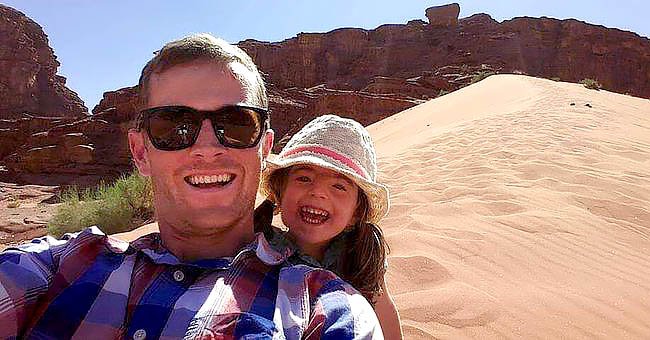 Chris Brannigan smiles with his daughter Hasti before a scenic view. | Source: Twitter.com/People