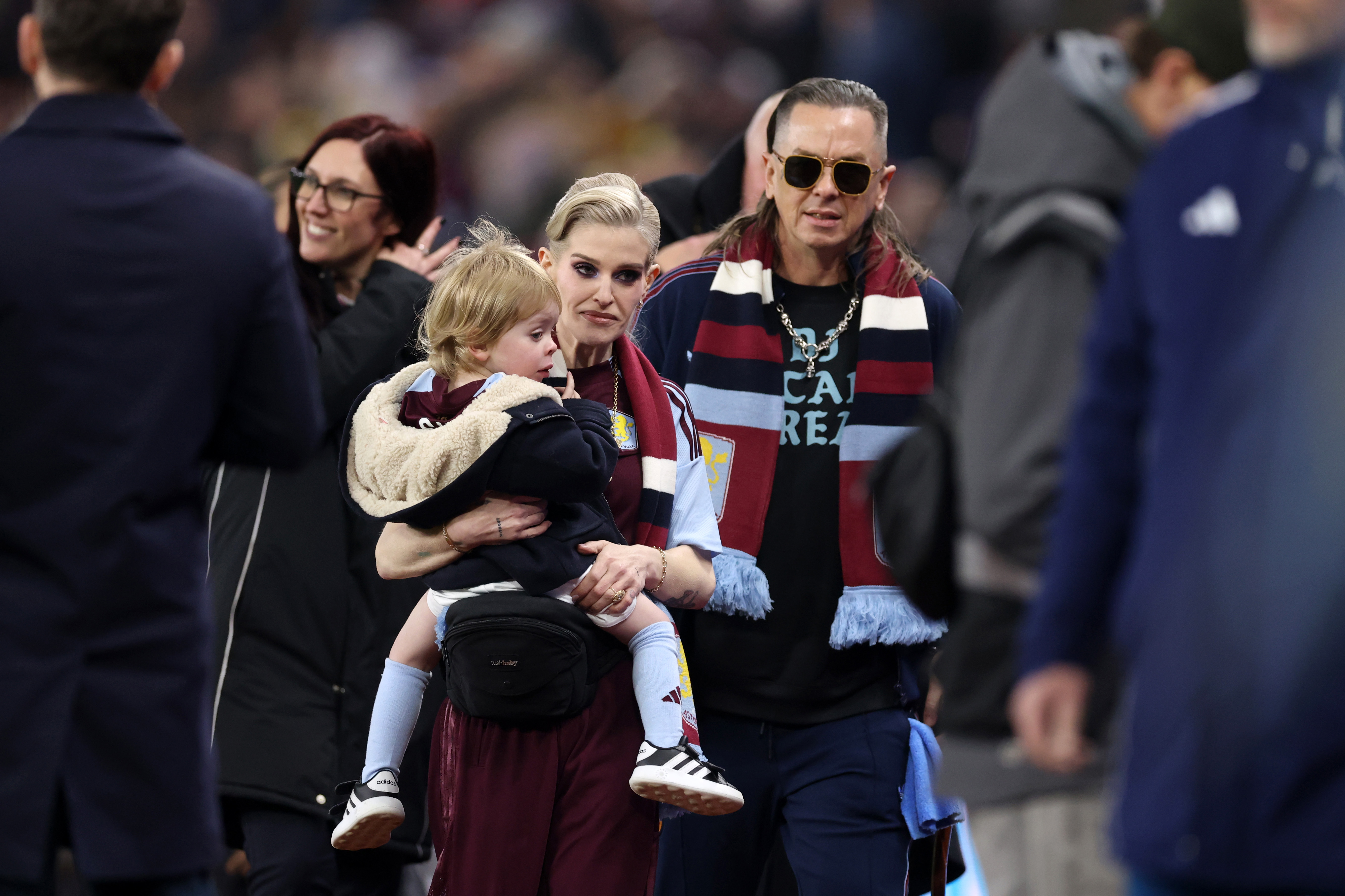 Kelly Osbourne is pictured with son Sidney and partner Sid Wilson ahead of the Premier League match between Aston Villa and Manchester United at Villa Park on 21 December 2025 in Birmingham, England. | Source: Getty Images