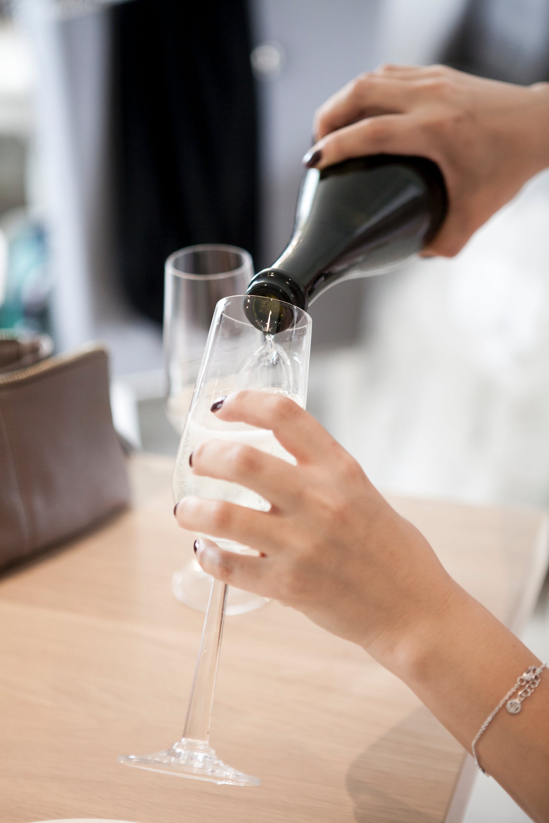 Person pouring champagne | Source: Pexels