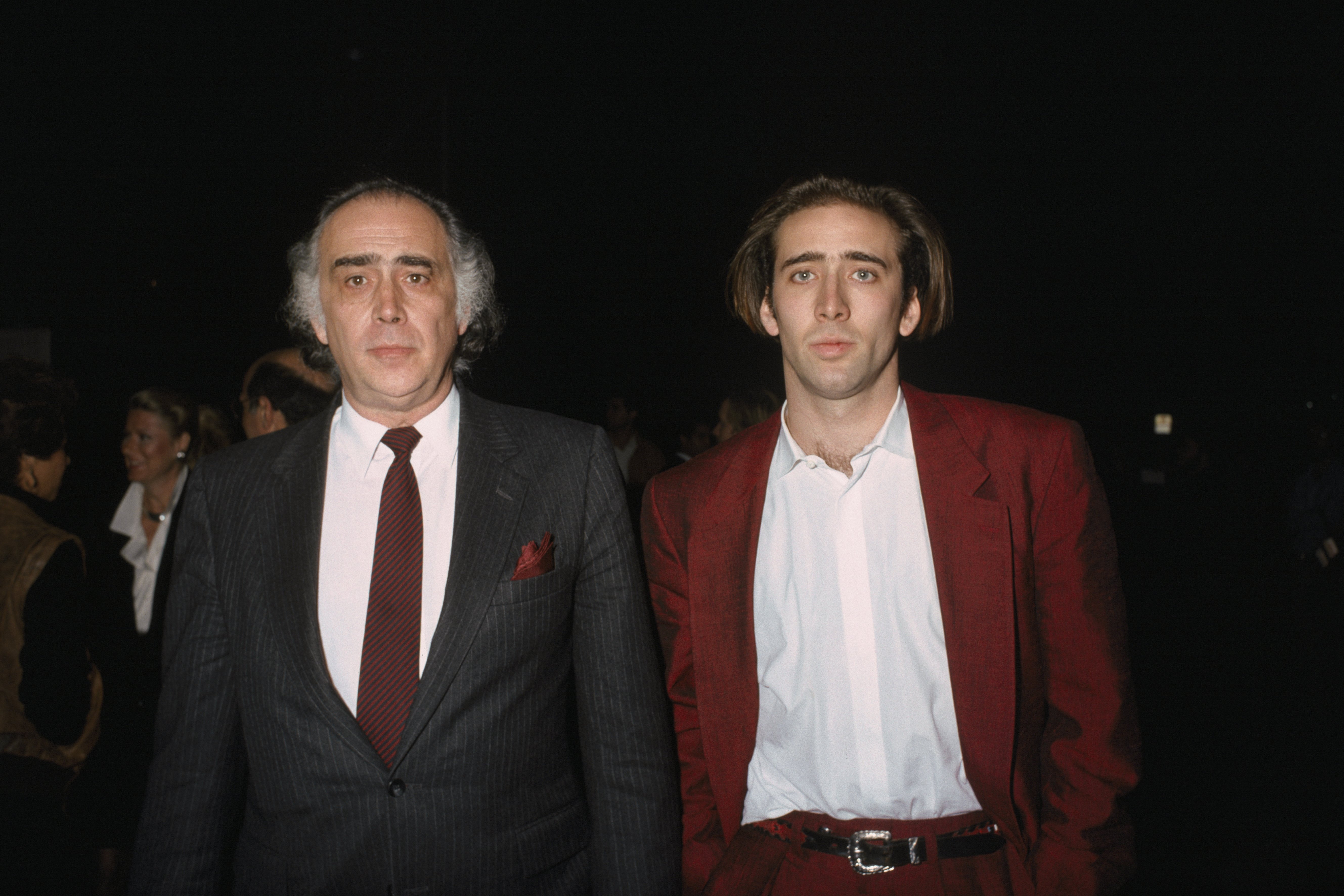 American actor Nicolas Cage and his father August Coppola attend the premiere of Moonstruck in 1988 | Source: Getty Images