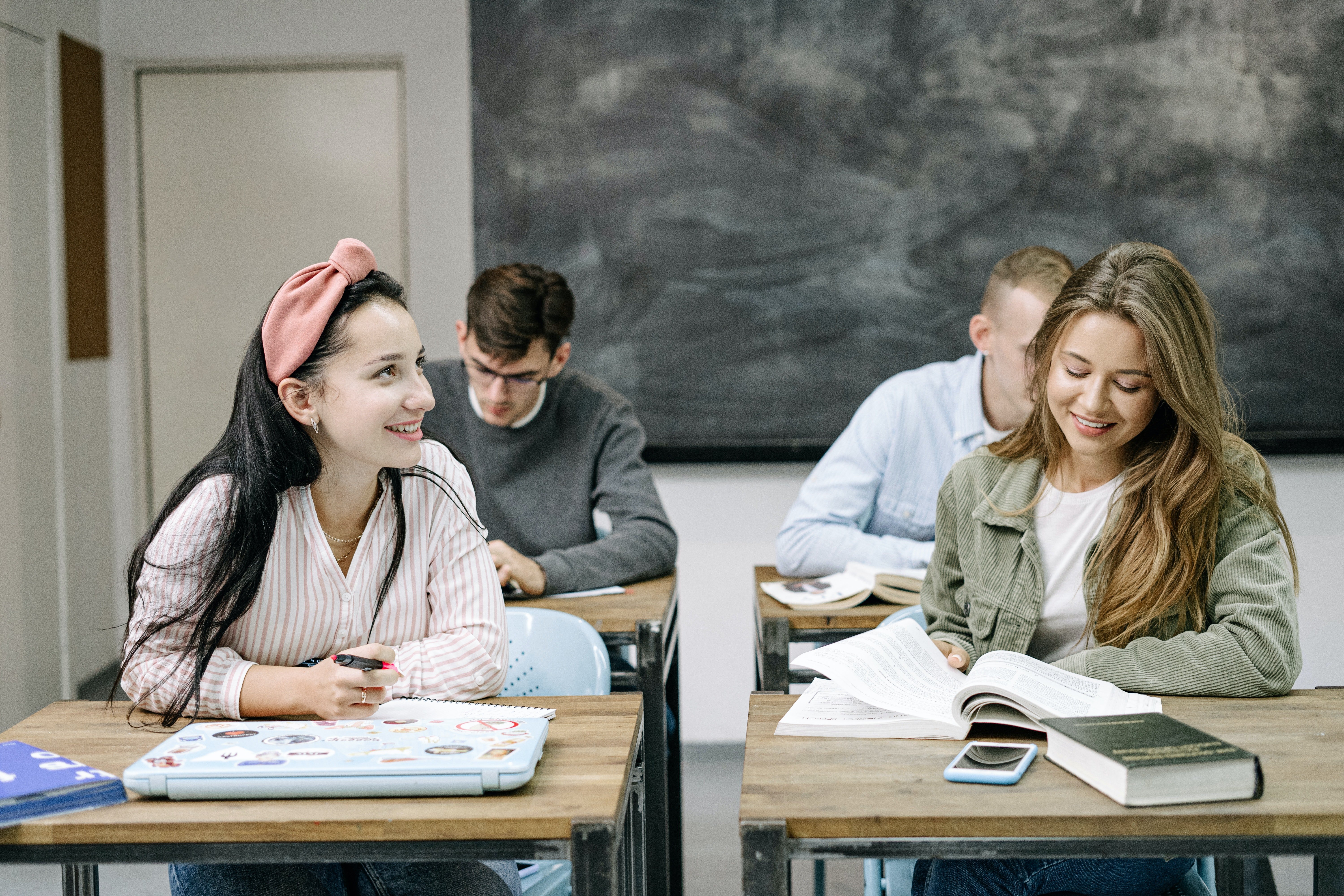 Pictured - Four students in a classrooms | Source: Pexels 