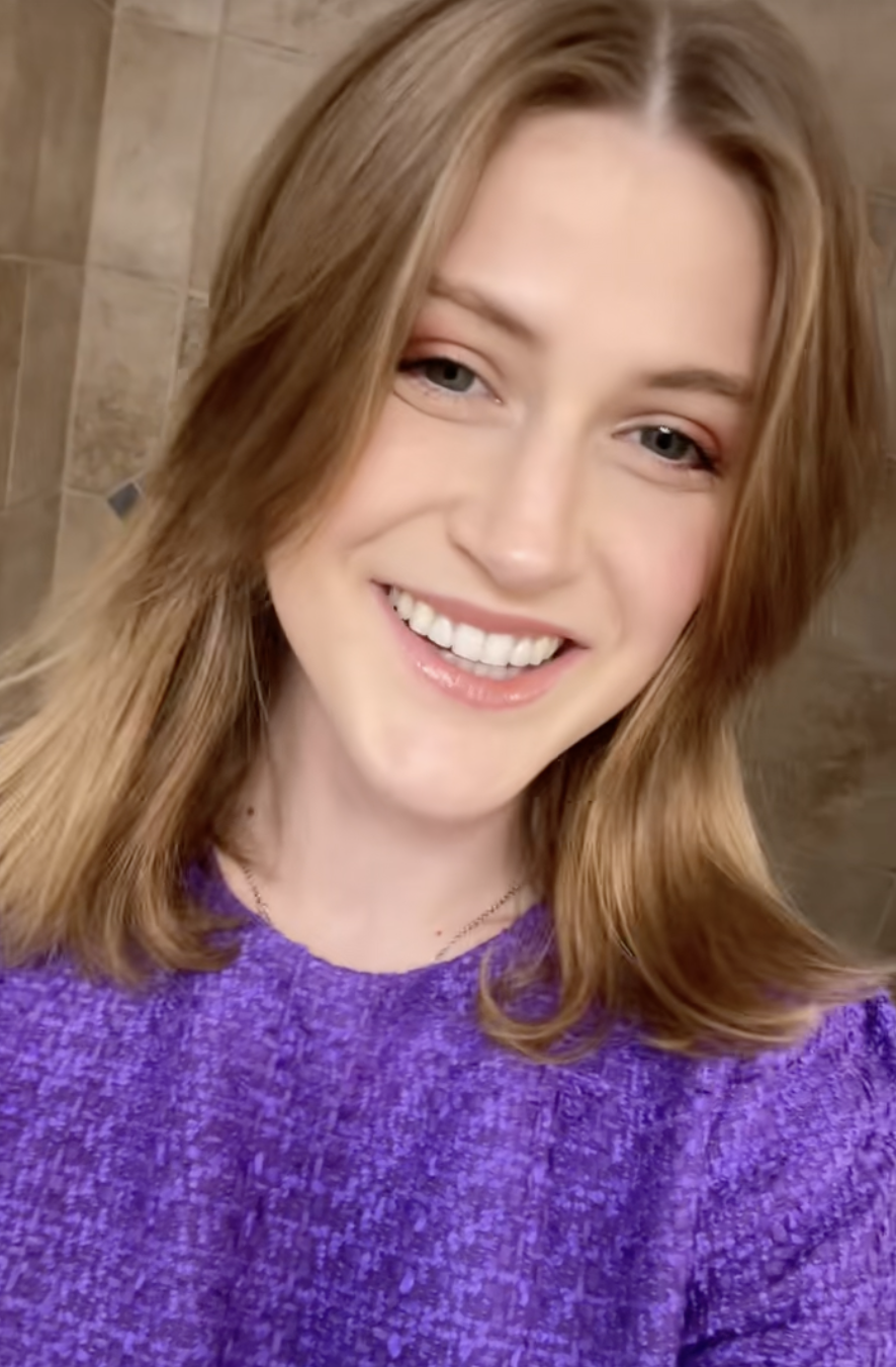 Wearing a vibrant purple blouse, Virginia Elder appears confident and fully healed. | Source: TikTok/virginiaeelder