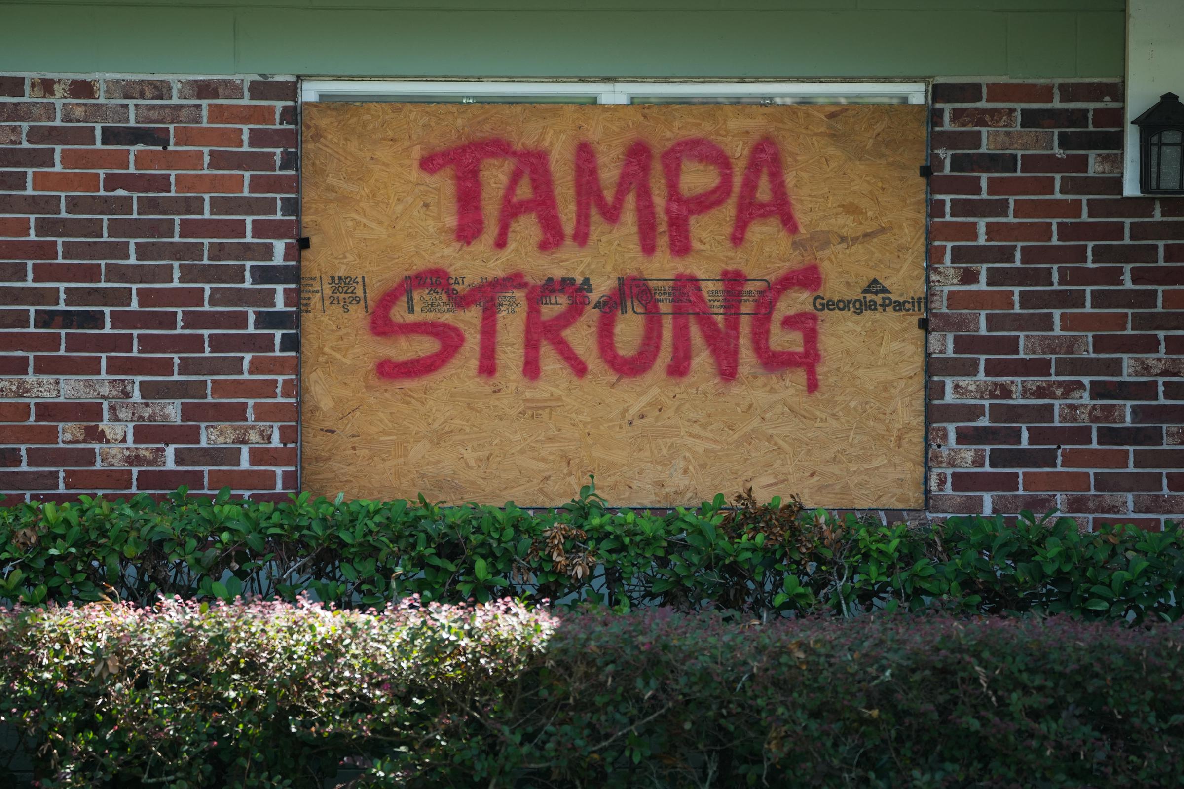 A message on boards put up over windows in Tampa ahead of Hurricane Milton's expected landfall on October 8, 2024, in Florida. | Source: Getty Images