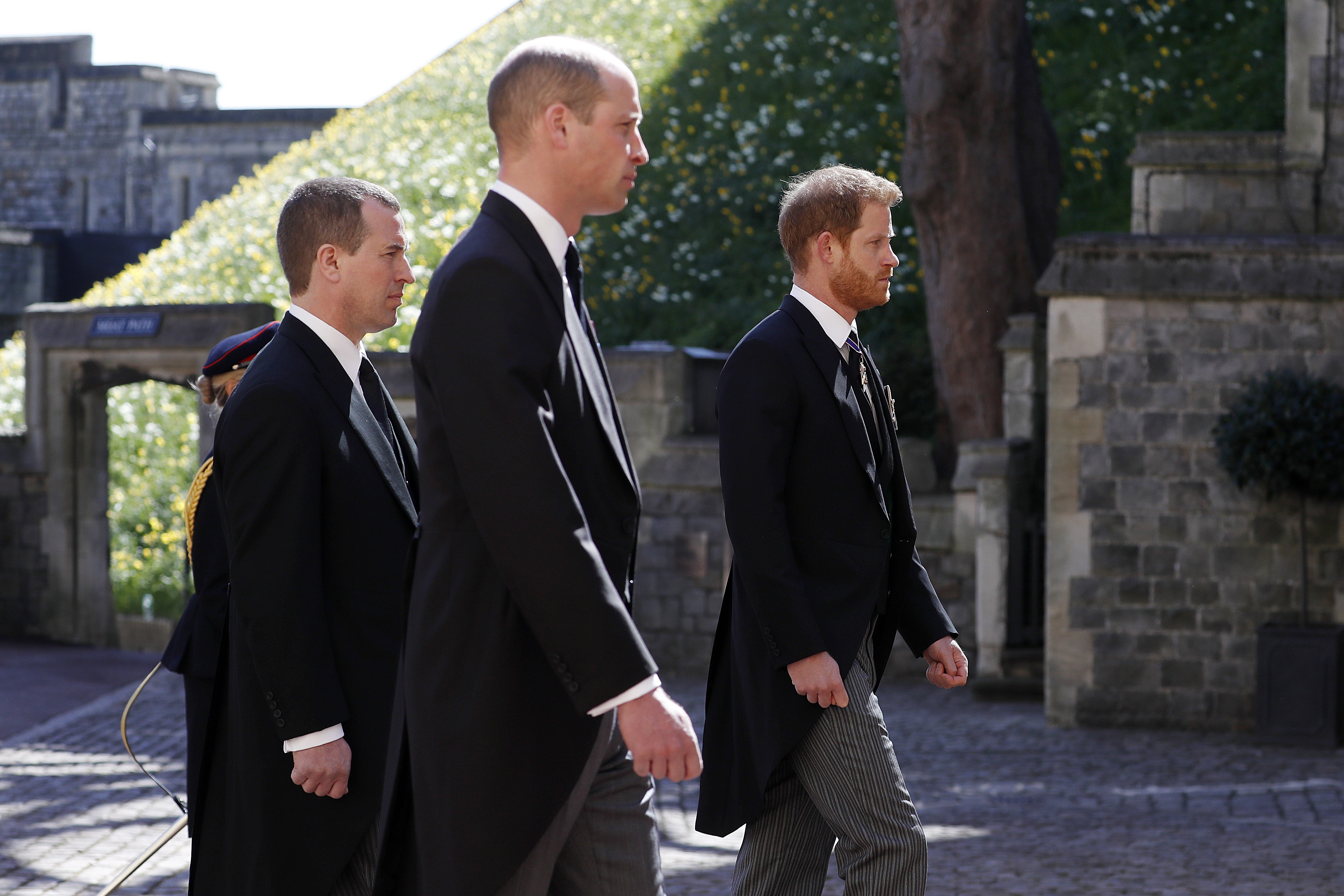  Peter Phillips, Prince William, Duke of Cambridge and Prince Harry, Duke of Sussex during the Ceremonial Procession during the funeral of Prince Philip, Duke of Edinburgh at Windsor Castle on April 17, 2021 in Windsor, England | Source: Getty Images 