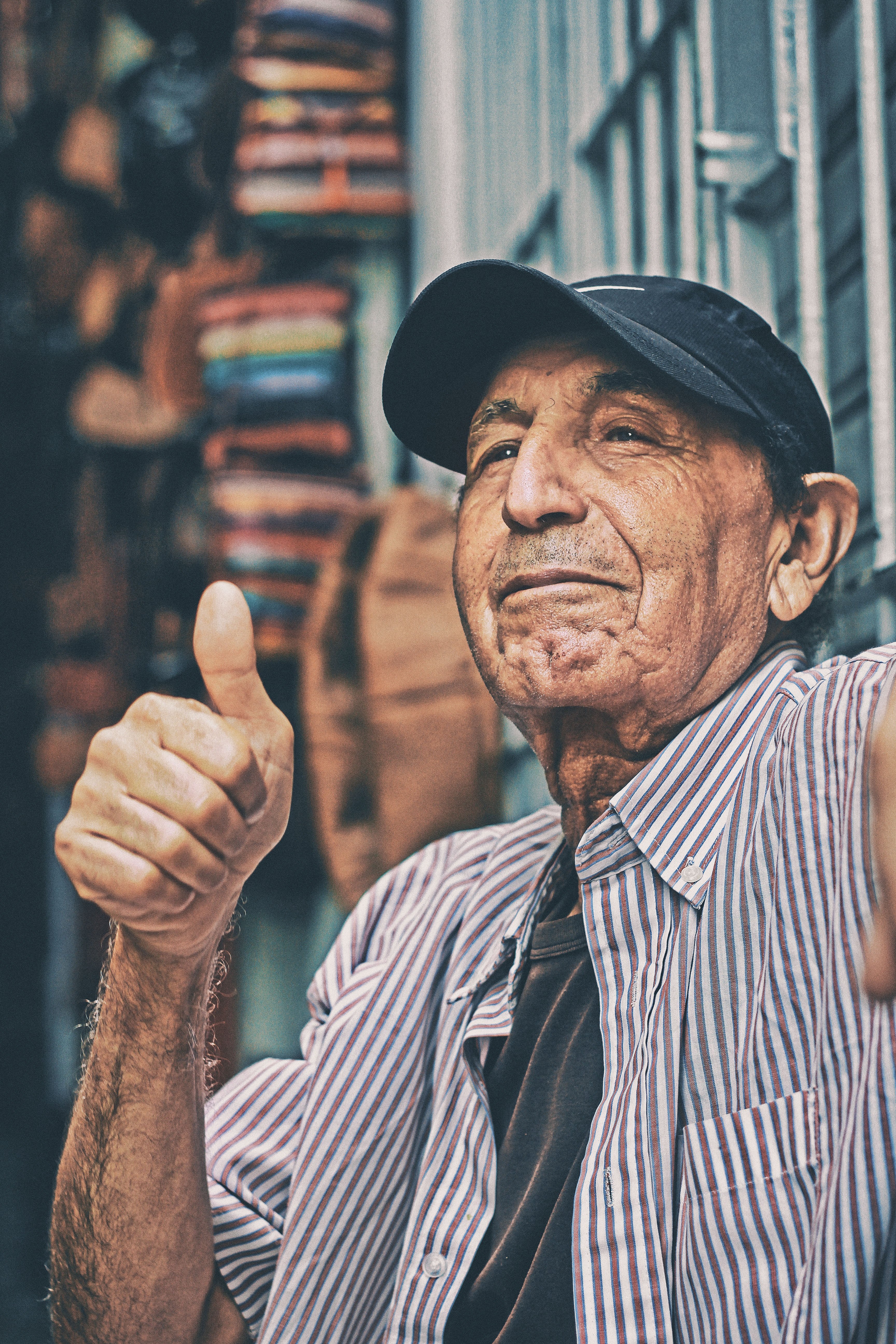 An old man giving a thumbs up. Source: Unsplash