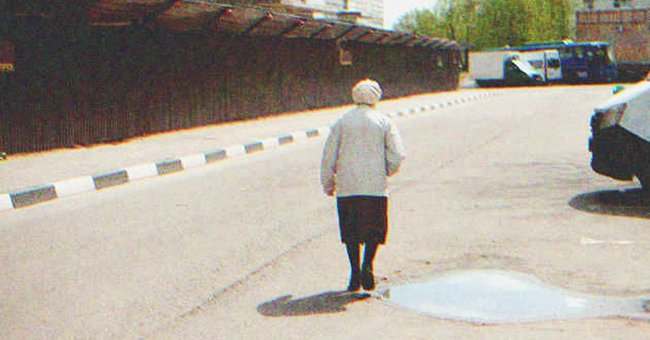 An old lady walking down the street | Source: Shutterstock
