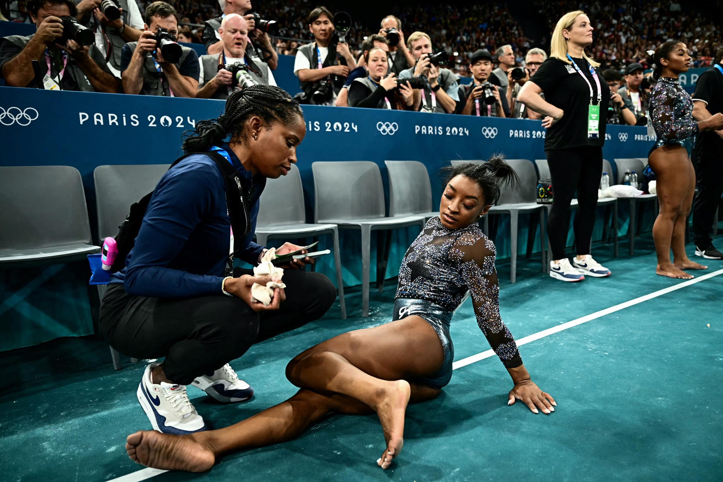 Marcia Faustin and Simone Biles during the Artistic Gymnastics Women's Qualification in Paris, France on July 28, 2024 | Source: Getty Images