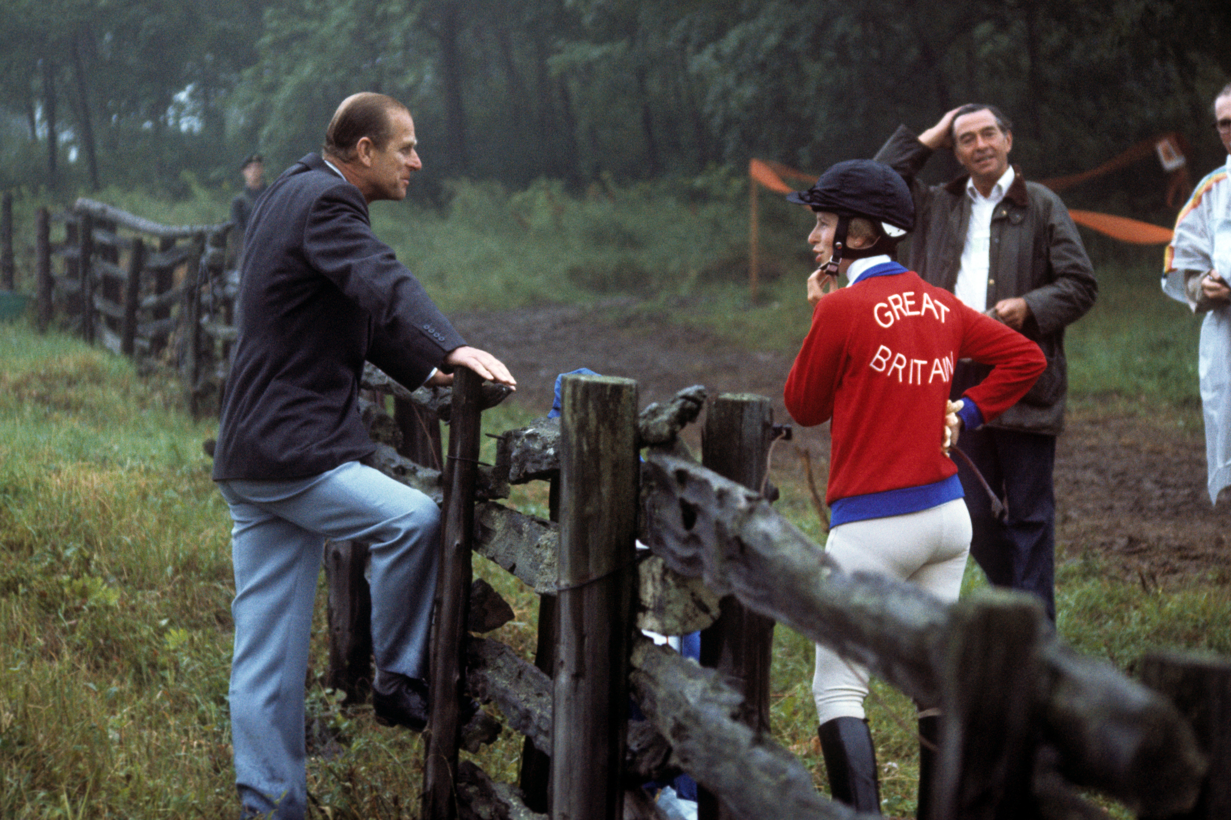 Princess Anne talking to her father, Prince Phillip at Bromont, Canada, during the Montreal Olympic Games in 1976. | Source: Getty Images