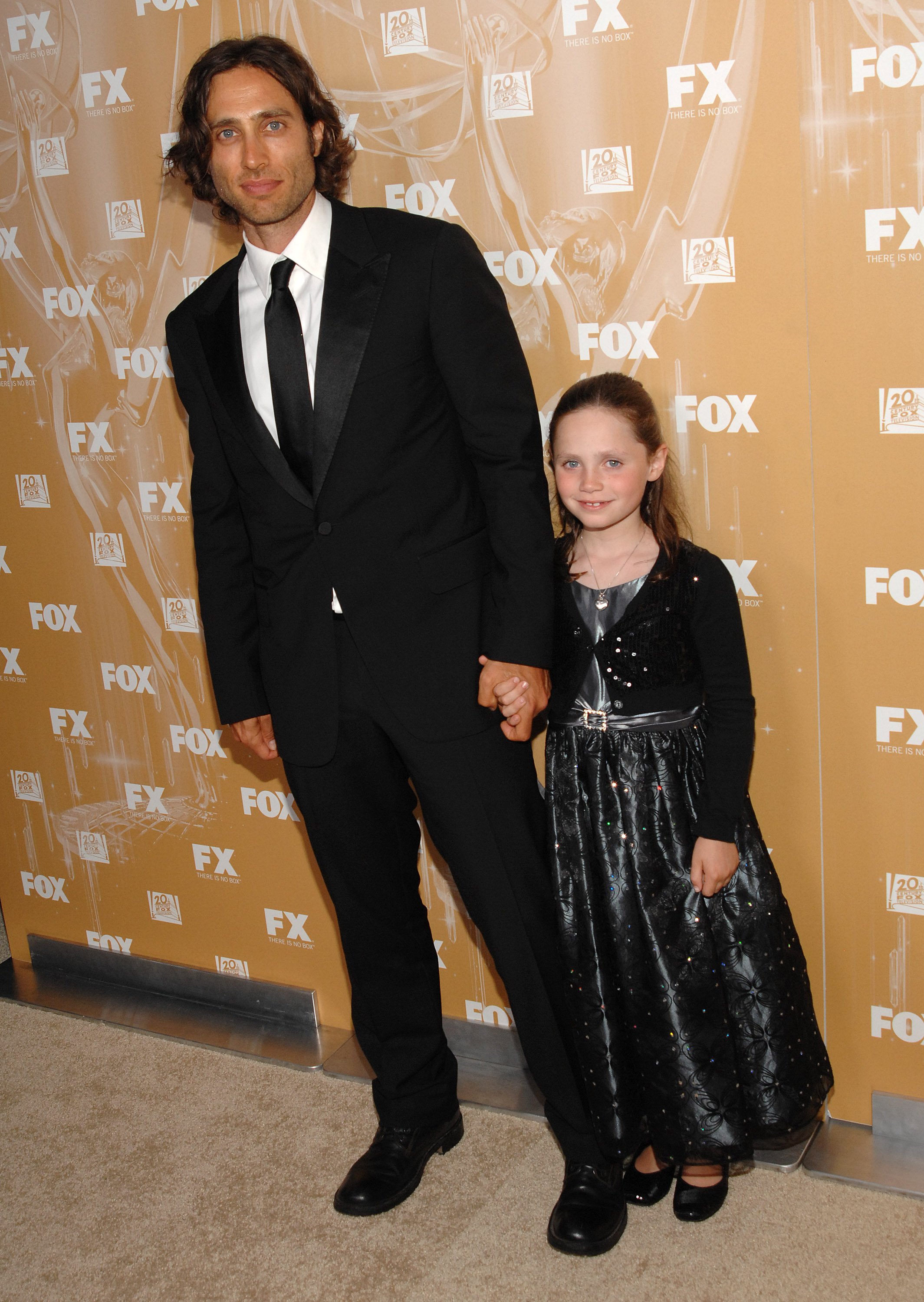 Brad Falchuk and Izzy Falchuk pose together at the Fox Broadcasting, Twentieth Ceuntury Fox and FX 2011 Emmy Nomination Celebration on September 18, 2011, in West Hollywood | Source: Getty Images