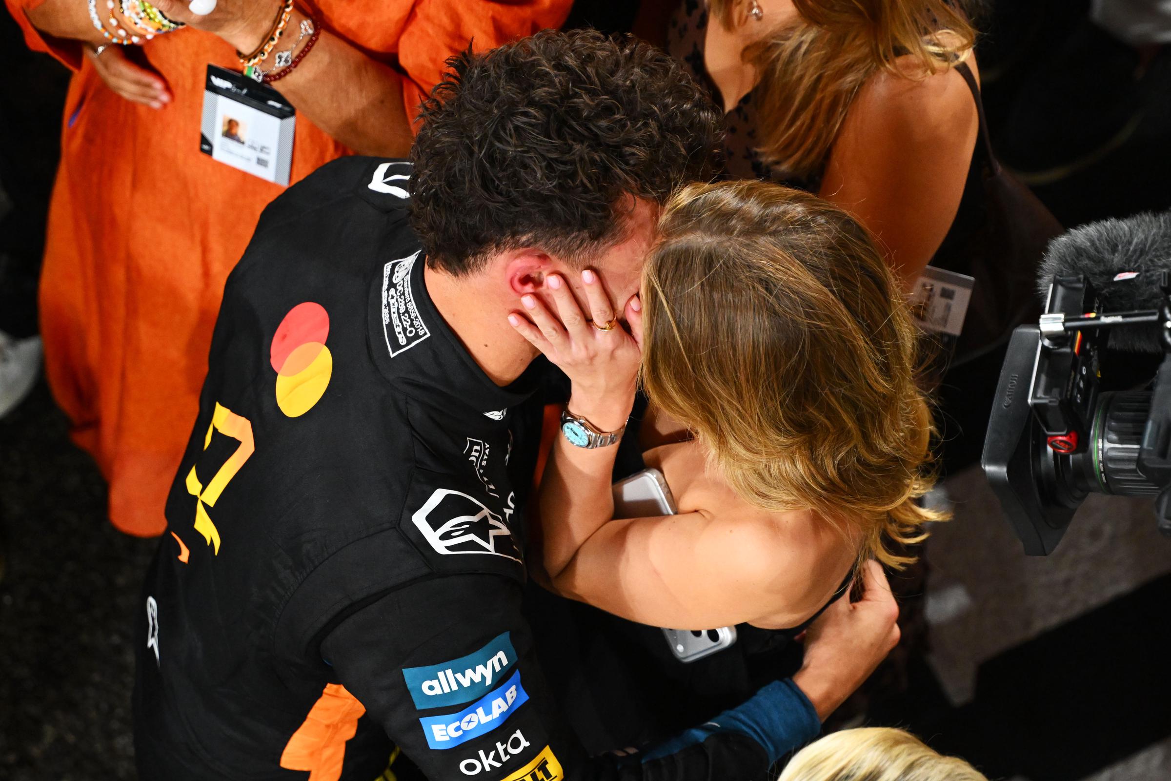 Lando Norris of Great Britain and McLaren celebrates with Magui Corceiro on December 07, 2025 in Abu Dhabi, United Arab Emirates. | Source: Getty Images