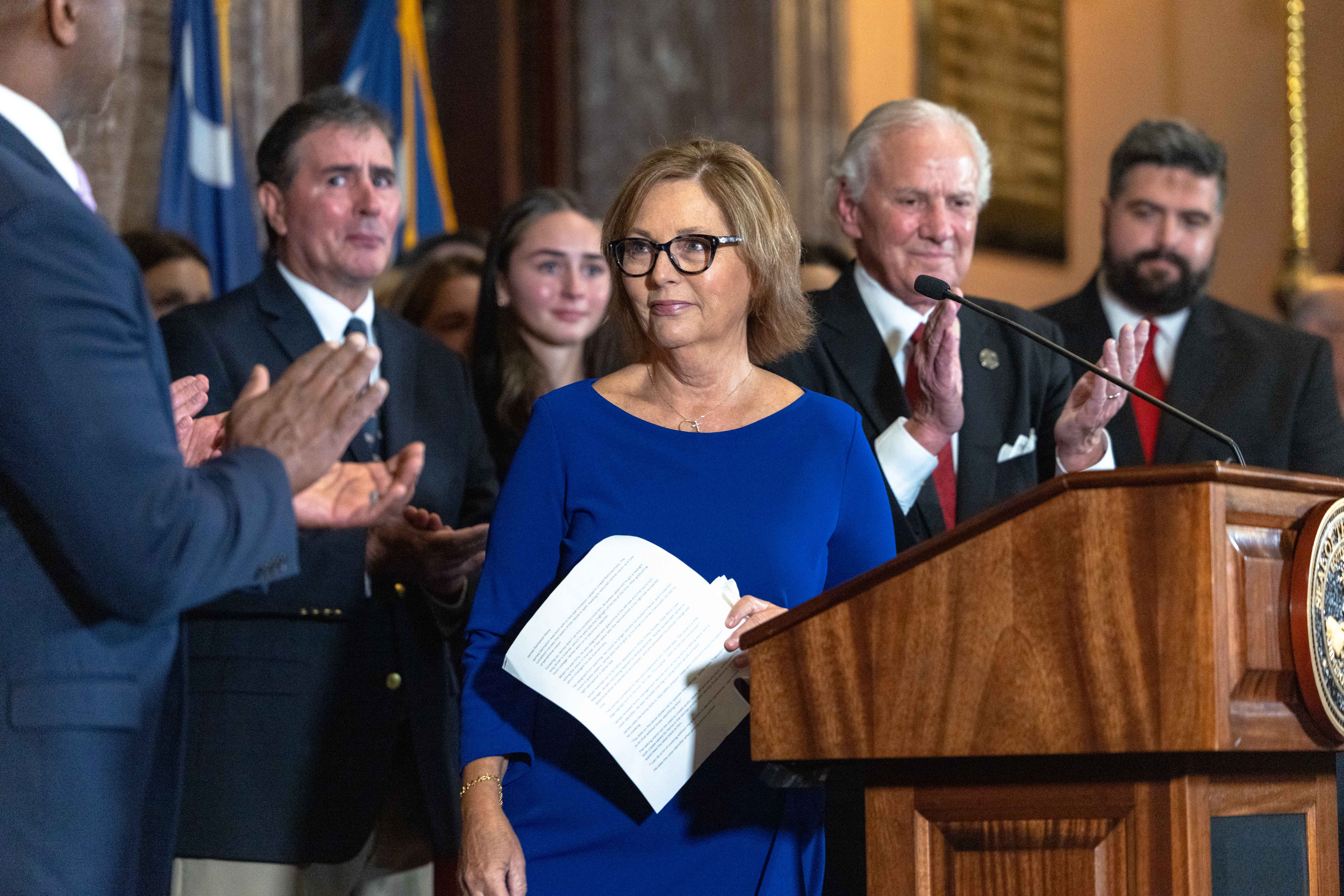 Flanked by South Carolina state leaders, Darline Graham Nordone addresses reporters at the State House on July 13, 2026, stepping into the spotlight following her sudden appointment to her late brother's Senate seat. | Source: Getty Images
