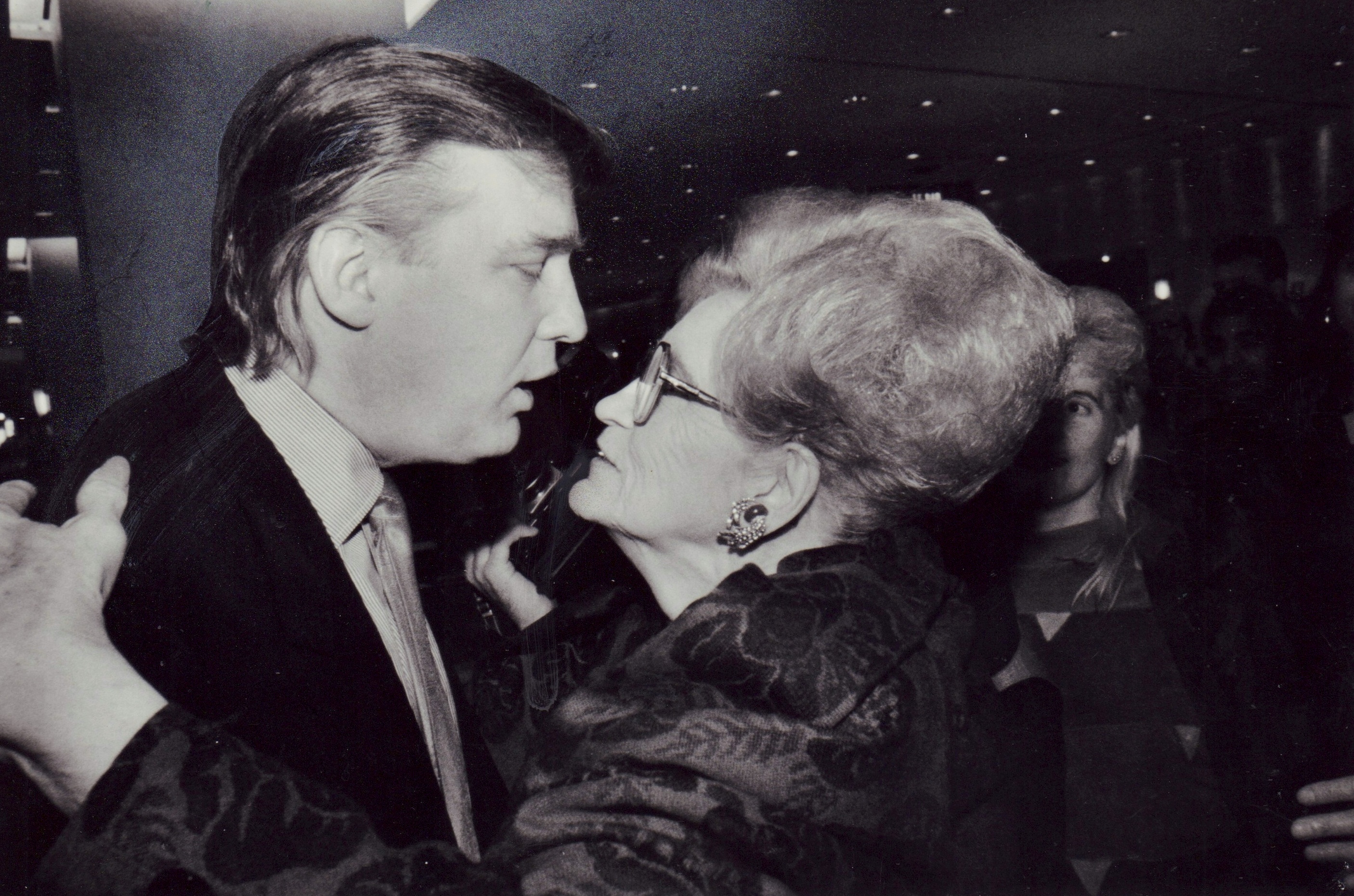 Donald Trump embraces his mother Mary Trump at the opening of the first Galleries Lafayette on September 28, 1991 | Source: Getty Images