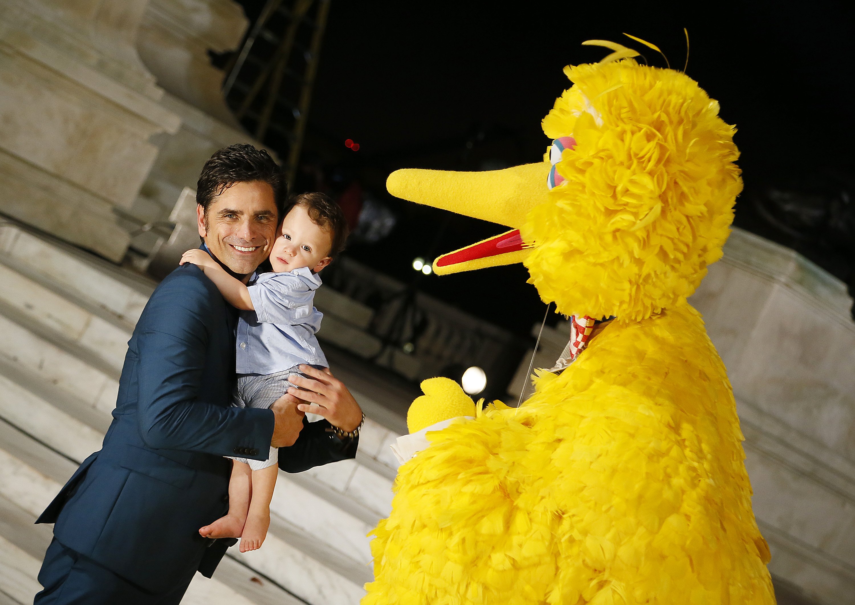 John Stamos with his son Billy Stamos poses beside "Sesame Street" muppet Big Bird on July 4, 2019, at the U.S. Capitol, West Lawn in Washington, DC. | Source: Getty Images