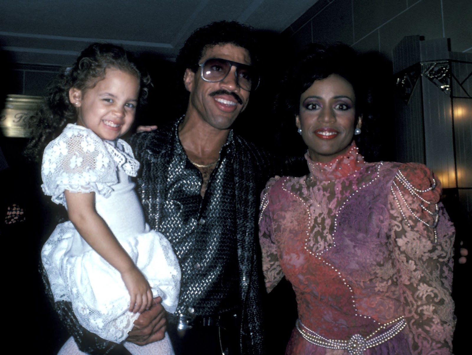 Nicole and Lionel Richie with Brenda Harvey photographed in New York in 1985. | Source: Getty Images