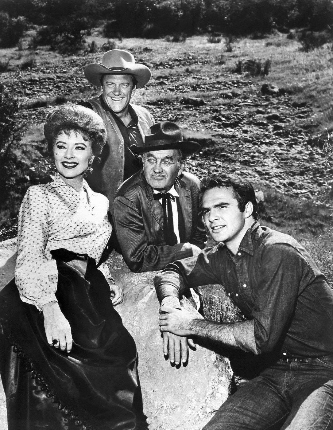 Amanda Blake (Miss Kitty), James Arness (Matt Dillon), Milburn Stone (Doc Adams), and Burt Reynolds (Quint Asper) in "Gunsmoke" in 1963. | Source: Wikimedia Commons.