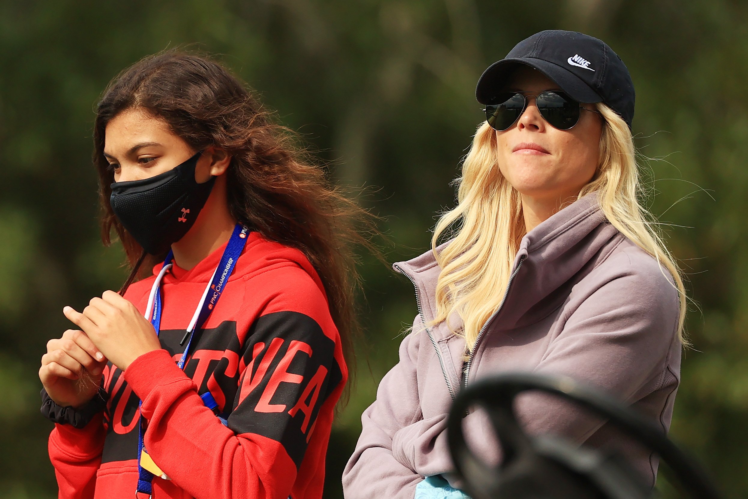  Sam Woods, daughter of Tiger Woods of the United States, and her mother Elin Nordegren look on during the final round of the PNC Championship at the Ritz-Carlton Golf Club Orlando on December 20, 2020, in Orlando, Florida. | Source: Getty Images