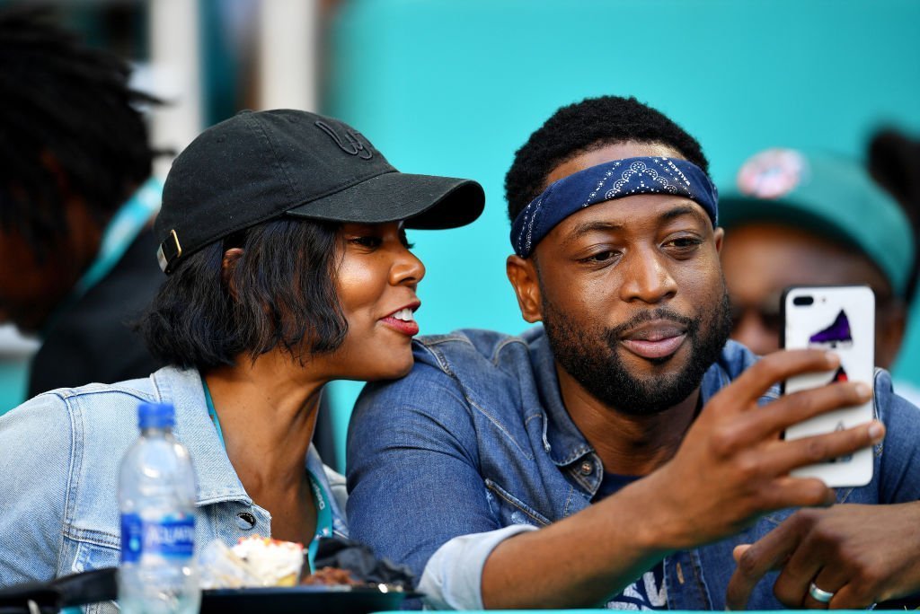 Dwyane Wade of the Miami Heat and wife and actress Gabrielle Union attend the game between the Miami Dolphins and Chicago Bears at Hard Rock Stadium in Miami, Florida | Photo: Getty Images