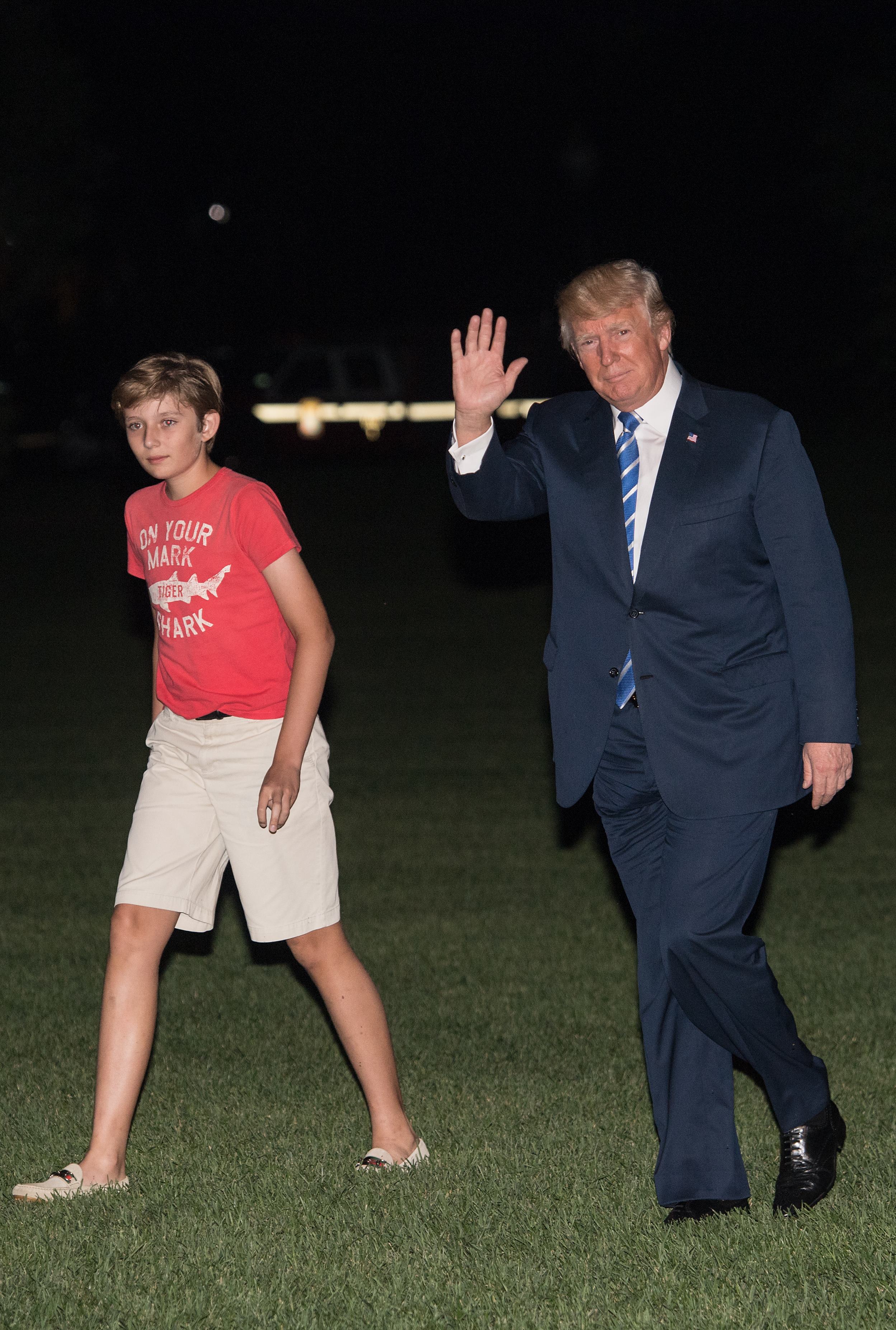 US President Donald Trump returns to the White House with his son Barron in Washington, DC, on August 20, 2017, after a 17-day "working vacation." | Source: Getty Images