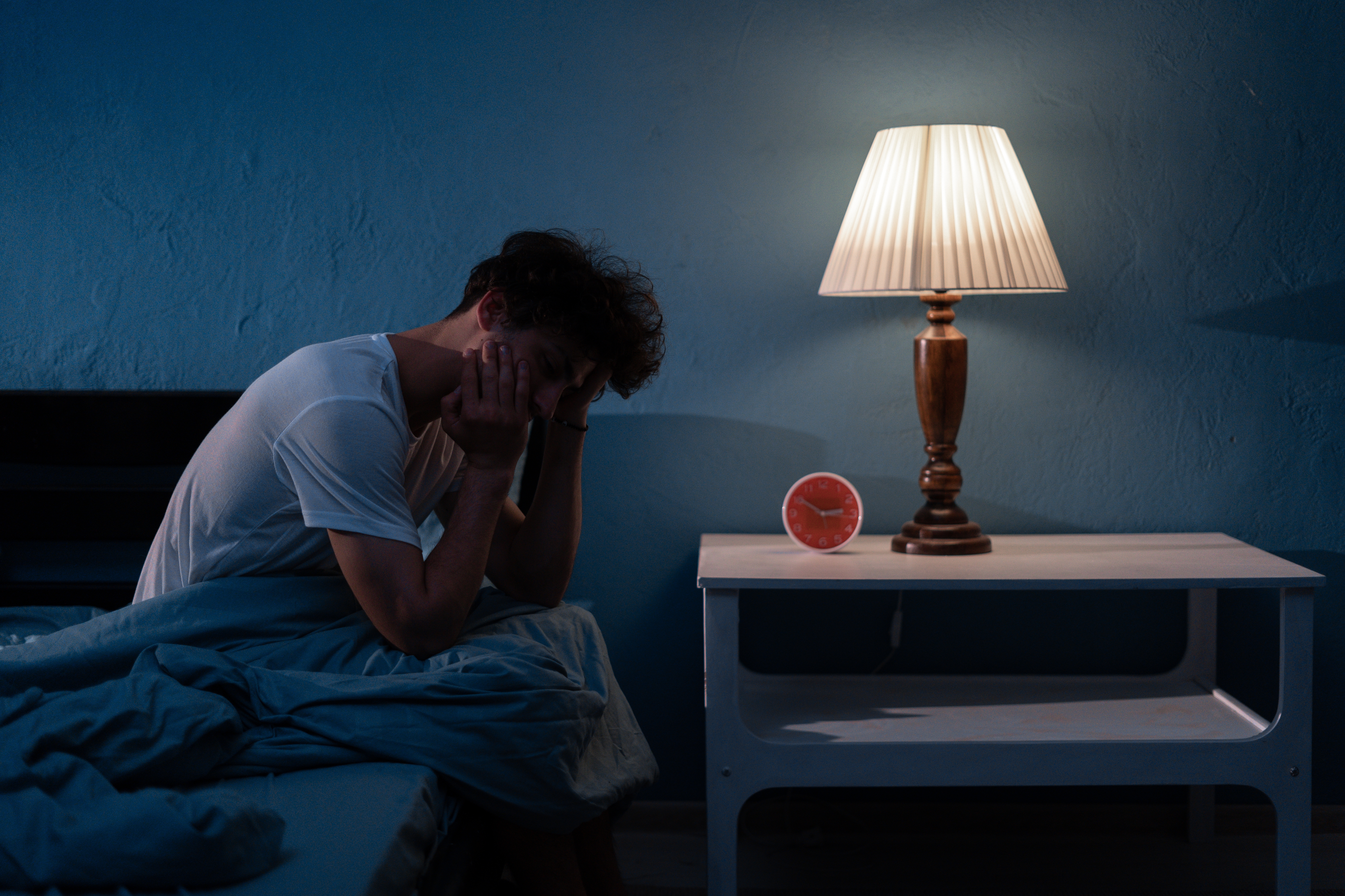 Sleepless, man suffering from insomnia | Source: Shutterstock