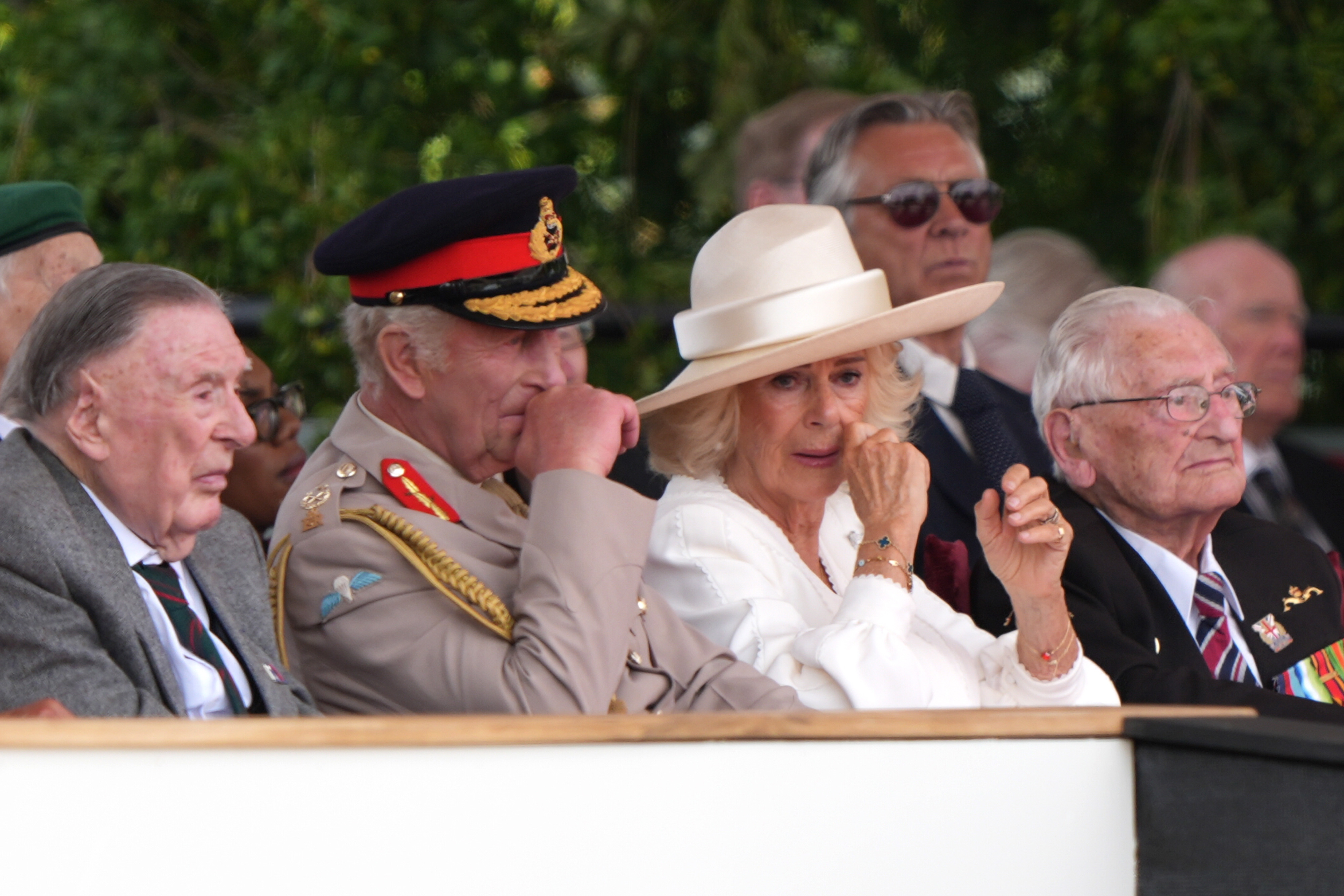 King Charles III and Queen Camilla react to veteran Yavar Abbas's comment at the National Memorial Arboretum in Staffordshire on August 15, 2025 | Source: Getty Images