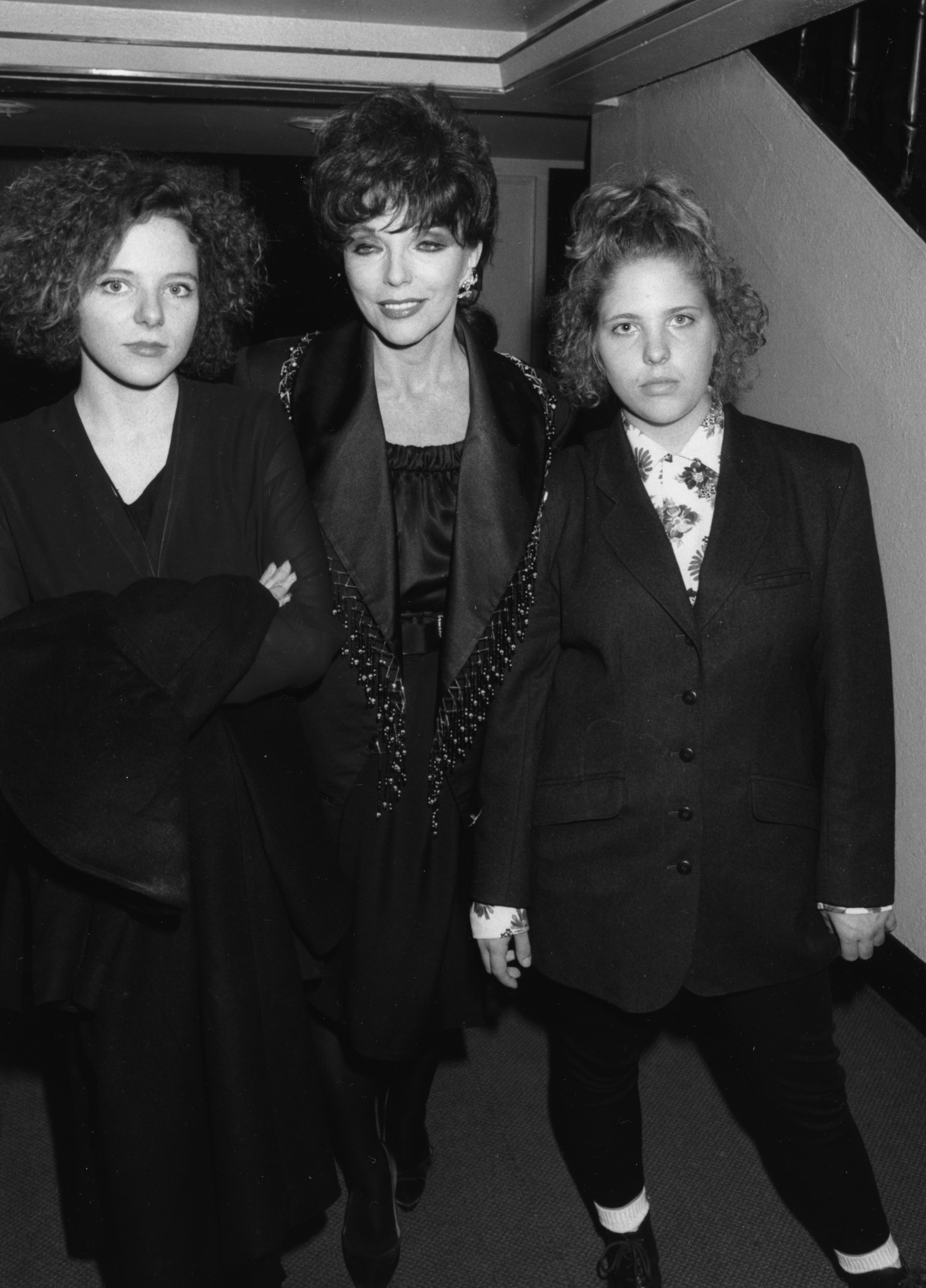 Joan Collins with her daughters Katie and Tara, attending a performance of her ex-husband Tony Newley's musical in London on October 27, 1989 | Source: Getty Images